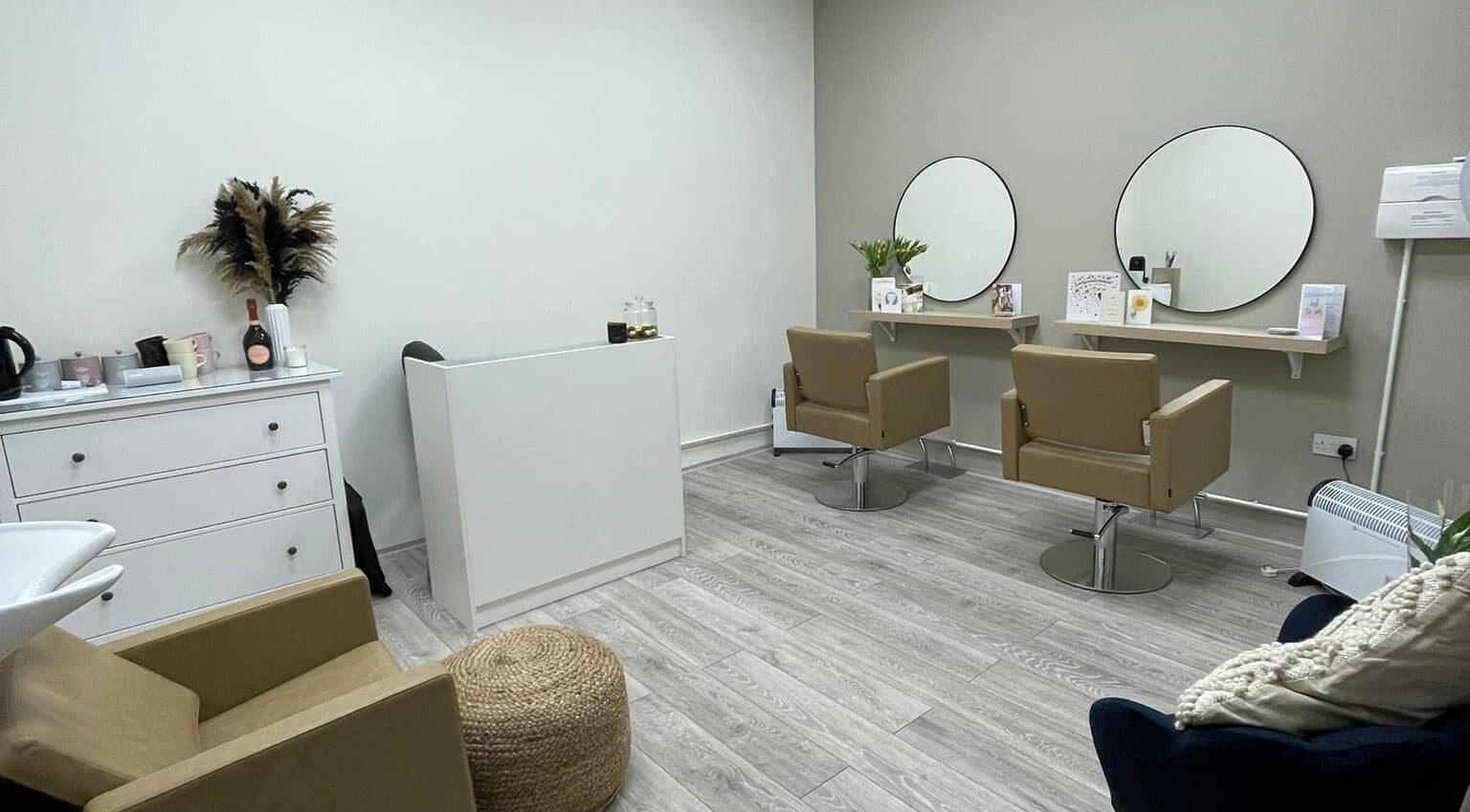 Modern salon chairs and mirrors at 11:11 Hairdressing, Wrexham, Wales, GB, showcasing a stylish beauty space.