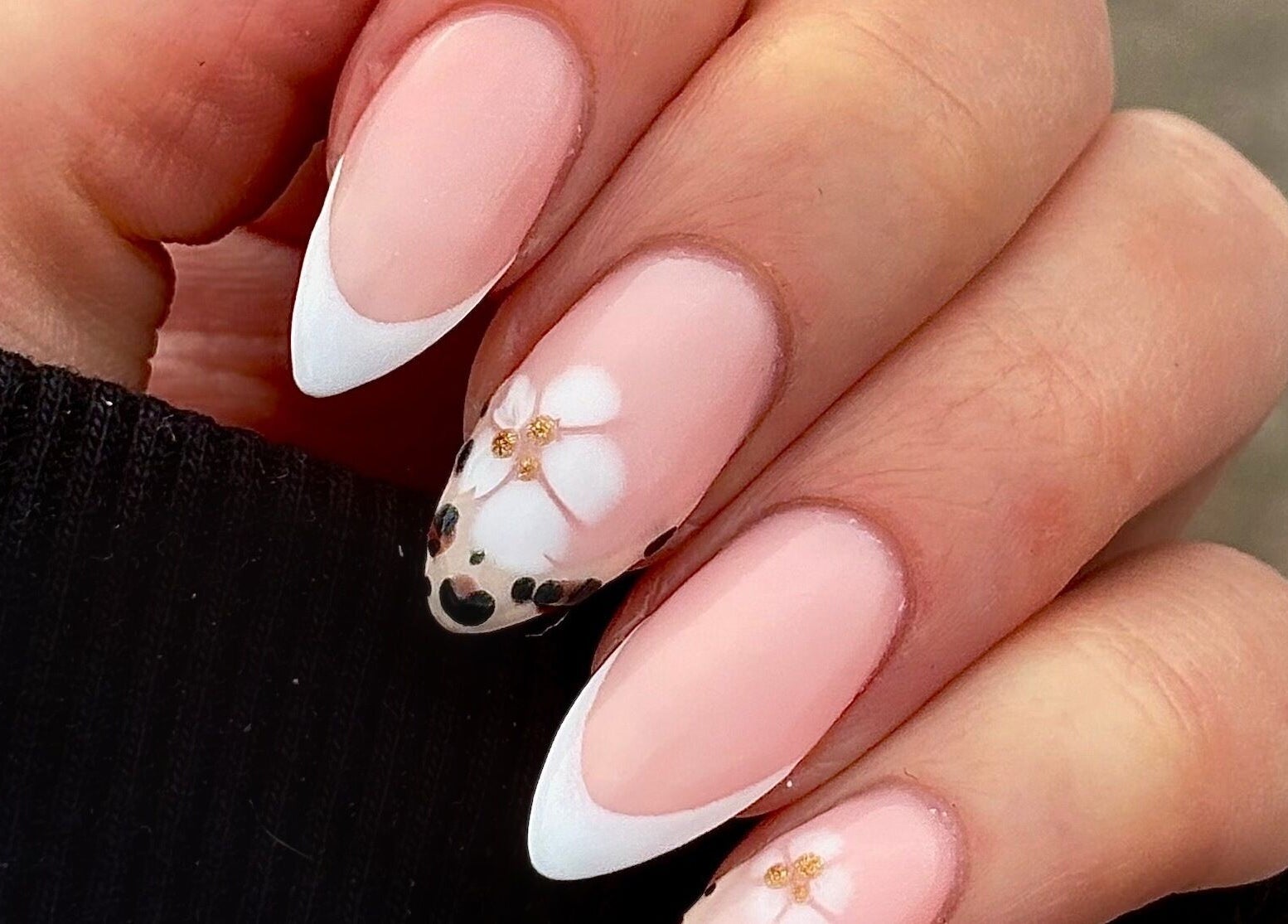 Elegant floral nail art at Darc’s Beauty in Frampton Cotterell, England, GB, showcasing delicate designs.