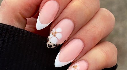 Elegant floral nail art at Darc’s Beauty in Frampton Cotterell, England, GB, showcasing delicate designs.