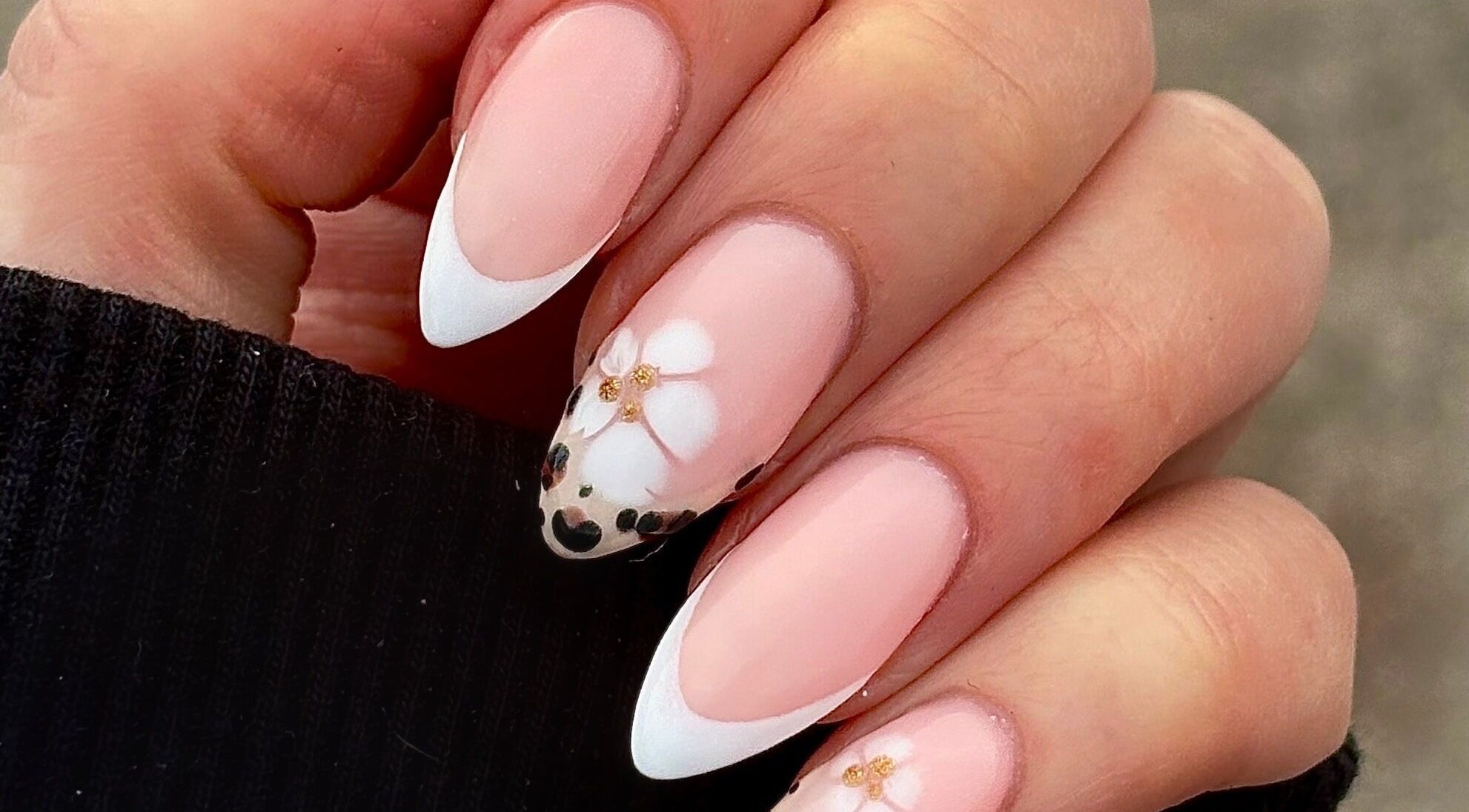 Elegant floral nail art at Darc’s Beauty in Frampton Cotterell, England, GB, showcasing delicate designs.