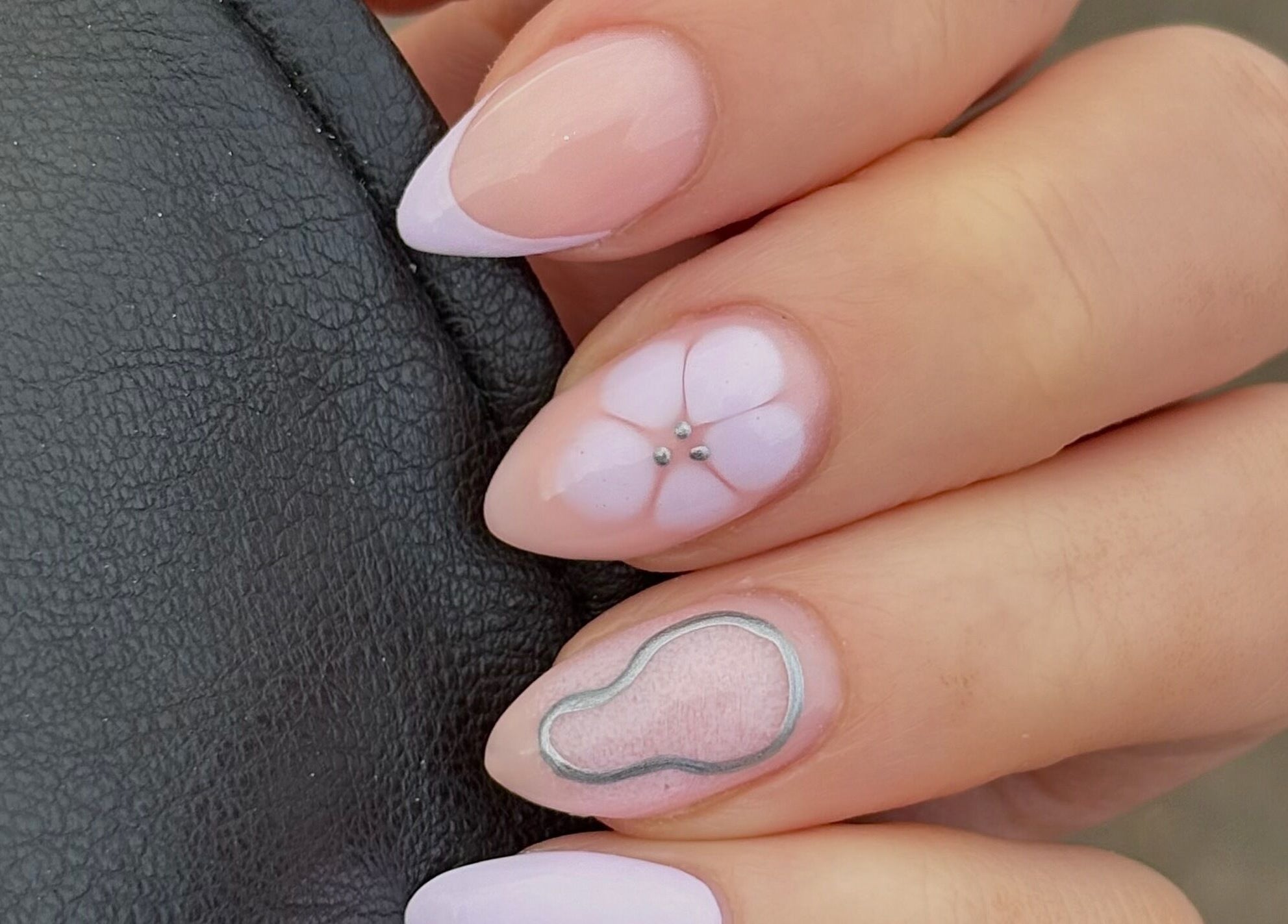 Elegant floral nail art at Darc’s Beauty in Frampton Cotterell, England, GB showcases glossy pastel designs.