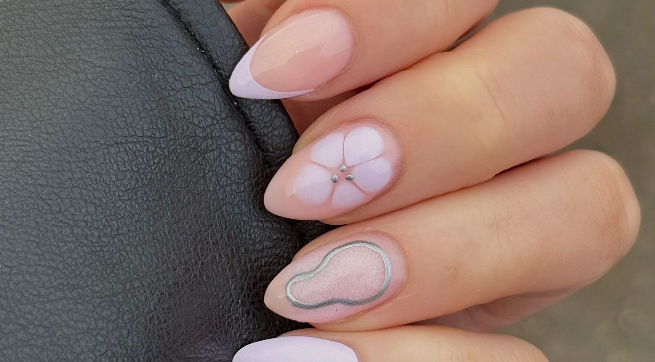 Elegant floral nail art at Darc’s Beauty in Frampton Cotterell, England, GB showcases glossy pastel designs.