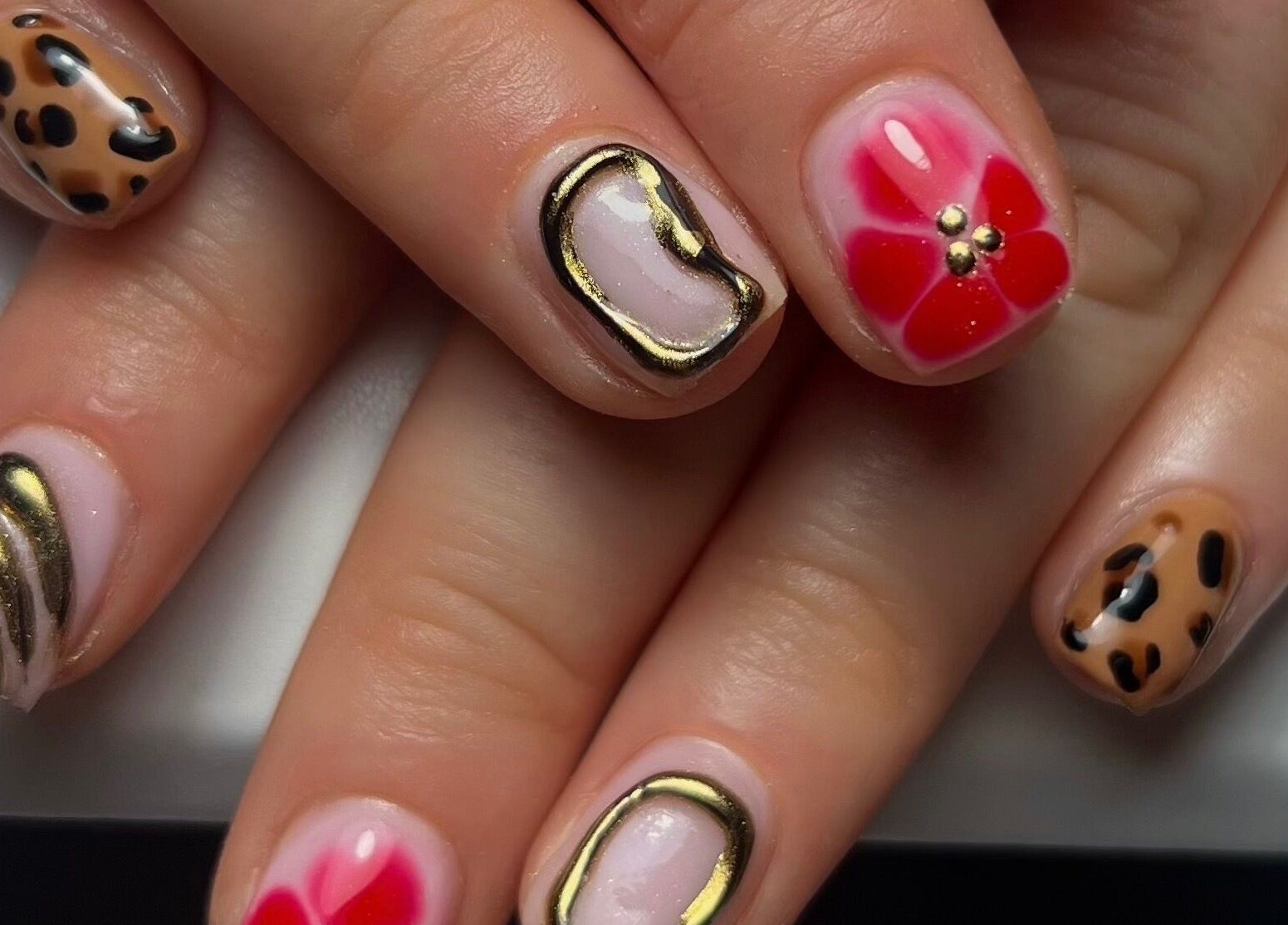 Intricate nail art at Darc’s Beauty, Frampton Cotterell, England, GB showcasing vibrant and elegant designs.