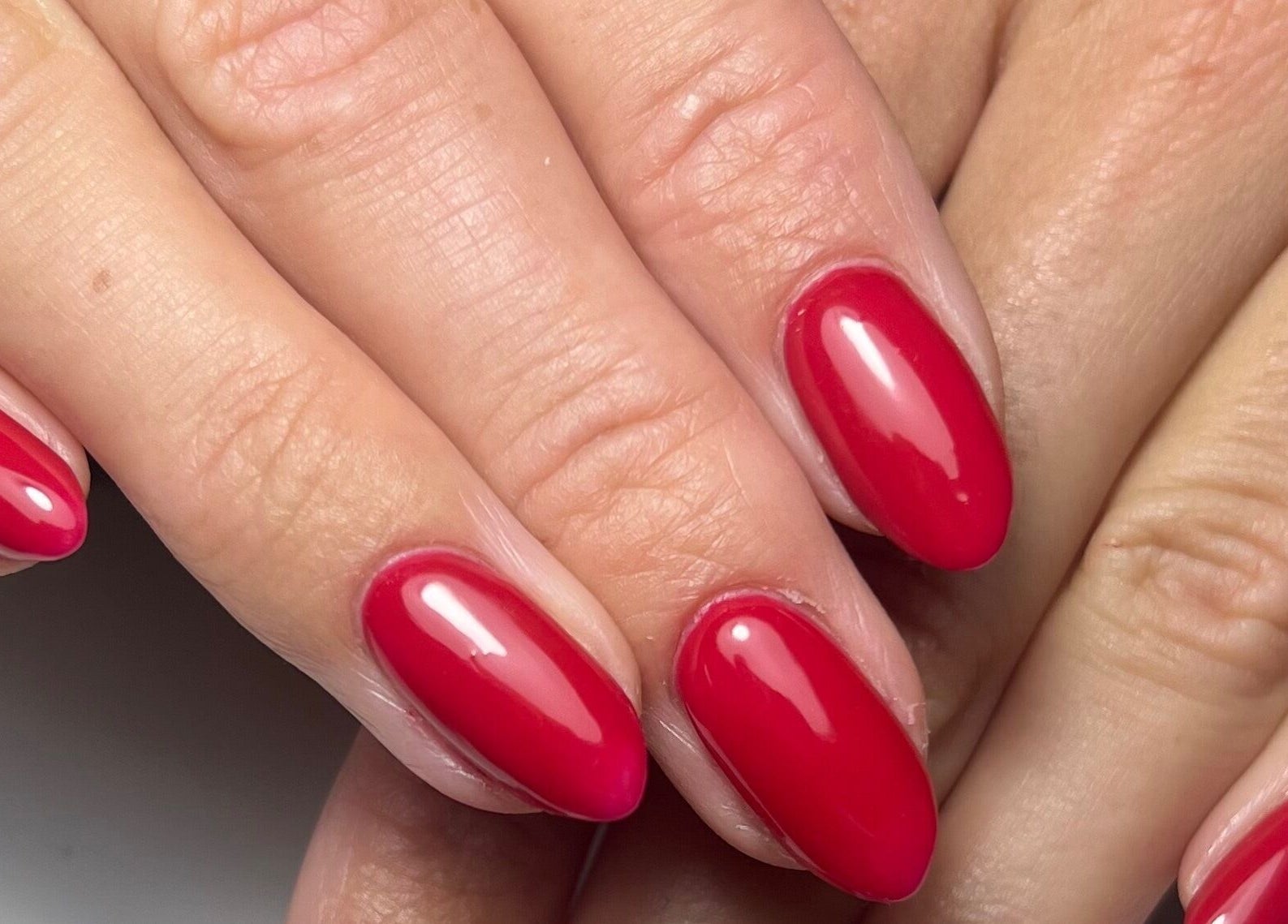Close-up of red manicured nails at Darc’s Beauty, Frampton Cotterell, England, GB.