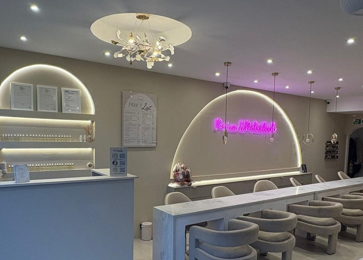 Elegant interior of Prim and Polished in Bexleyheath, England, GB with modern decor and ambient lighting.