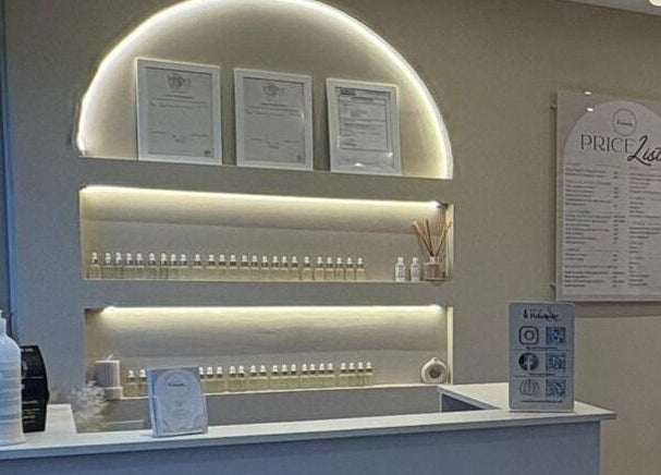 Reception area at Prim and Polished, Bexleyheath, England, GB showcasing certificates and price list.