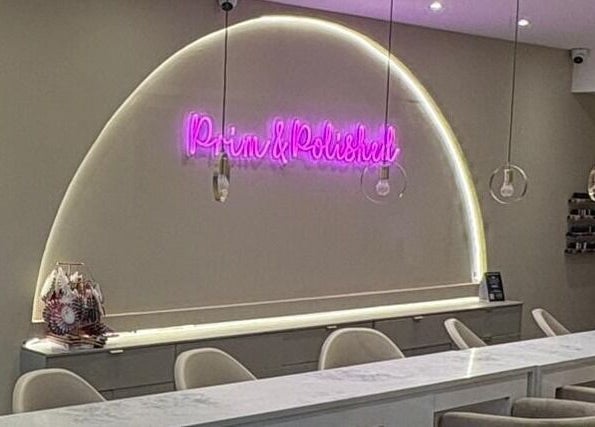 Elegant Prim and Polished interior with neon sign in Bexleyheath, England, GB.