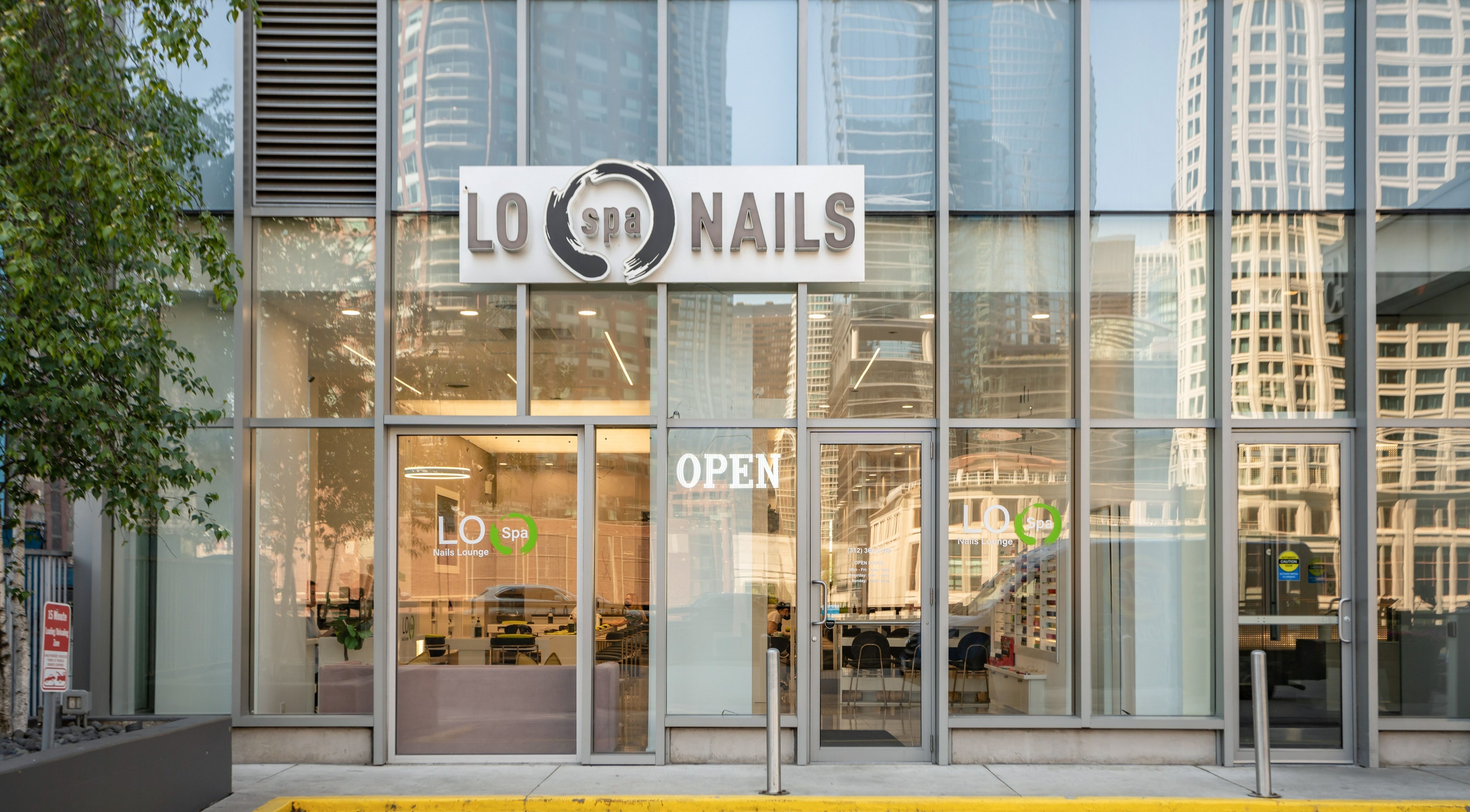 Front view of LO Spa & Nails at Lakeshore East, Chicago, Illinois, US, showcasing modern glass facade.