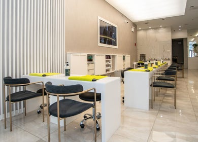 Modern nail salon interior at LO Spa & Nails at Lakeshore East, Chicago, Illinois, US, showcasing elegant seating.