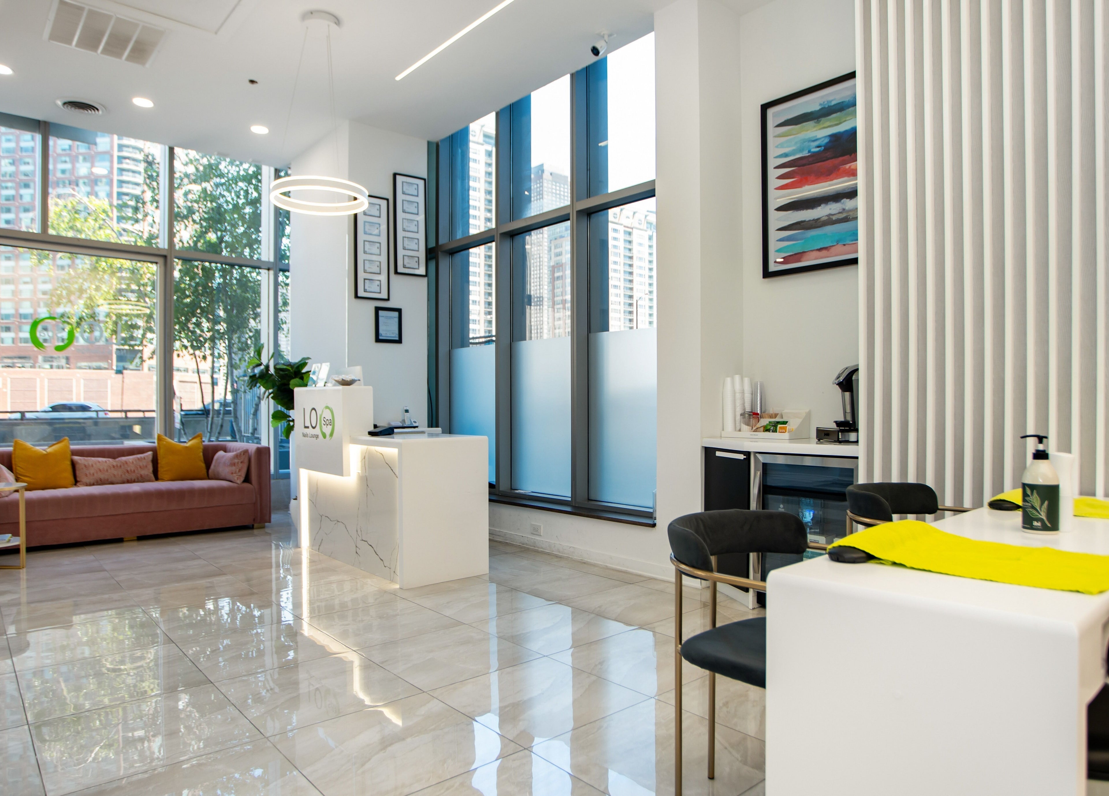 Interior of LO Spa & Nails at Lakeshore East, Chicago, Illinois, US. Modern, inviting design with large windows.