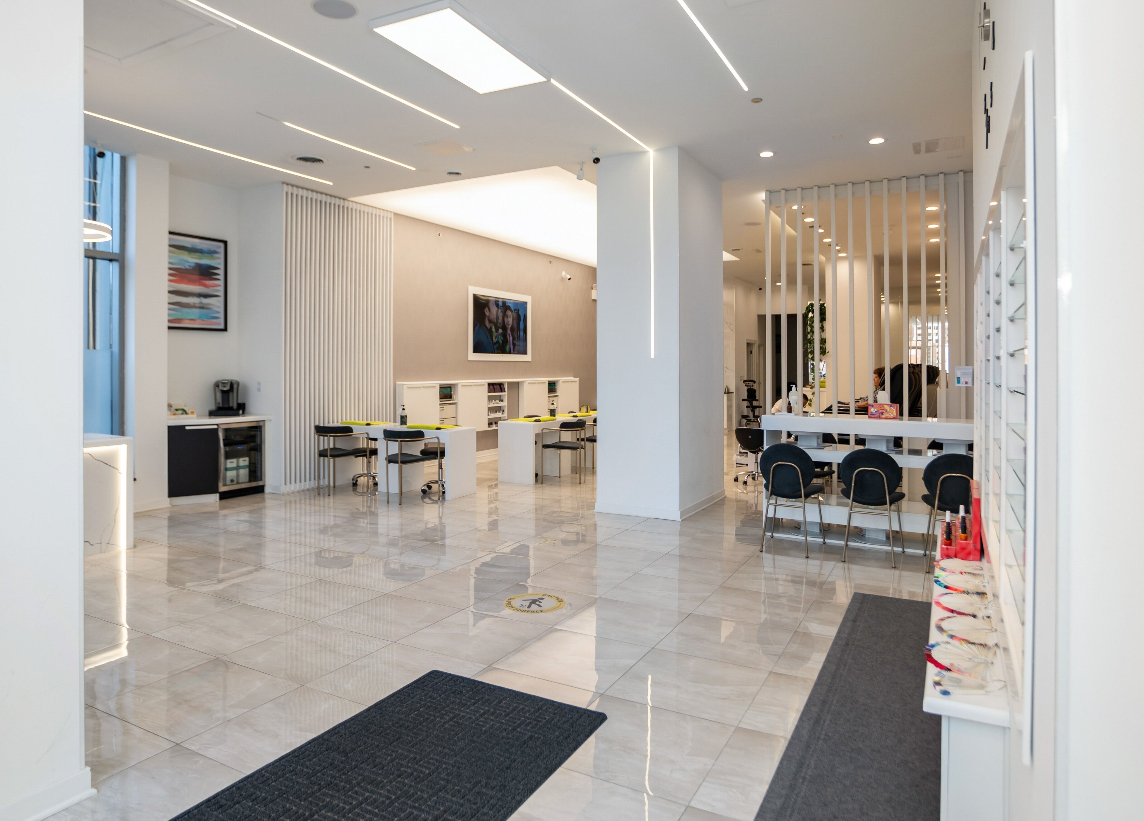 Spacious interior of LO Spa & Nails at Lakeshore East in Chicago, Illinois, US, featuring sleek nail stations.