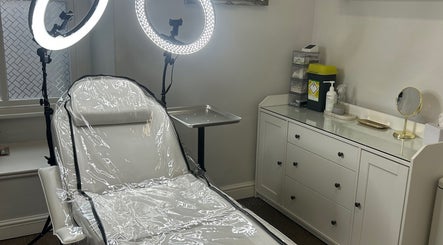 Serene treatment room at Impeccable Aesthetics in Warrington, England, GB with modern equipment and lighting.