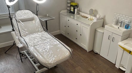 Treatment room at Impeccable Aesthetics, Warrington, England, GB with modern decor and professional equipment.