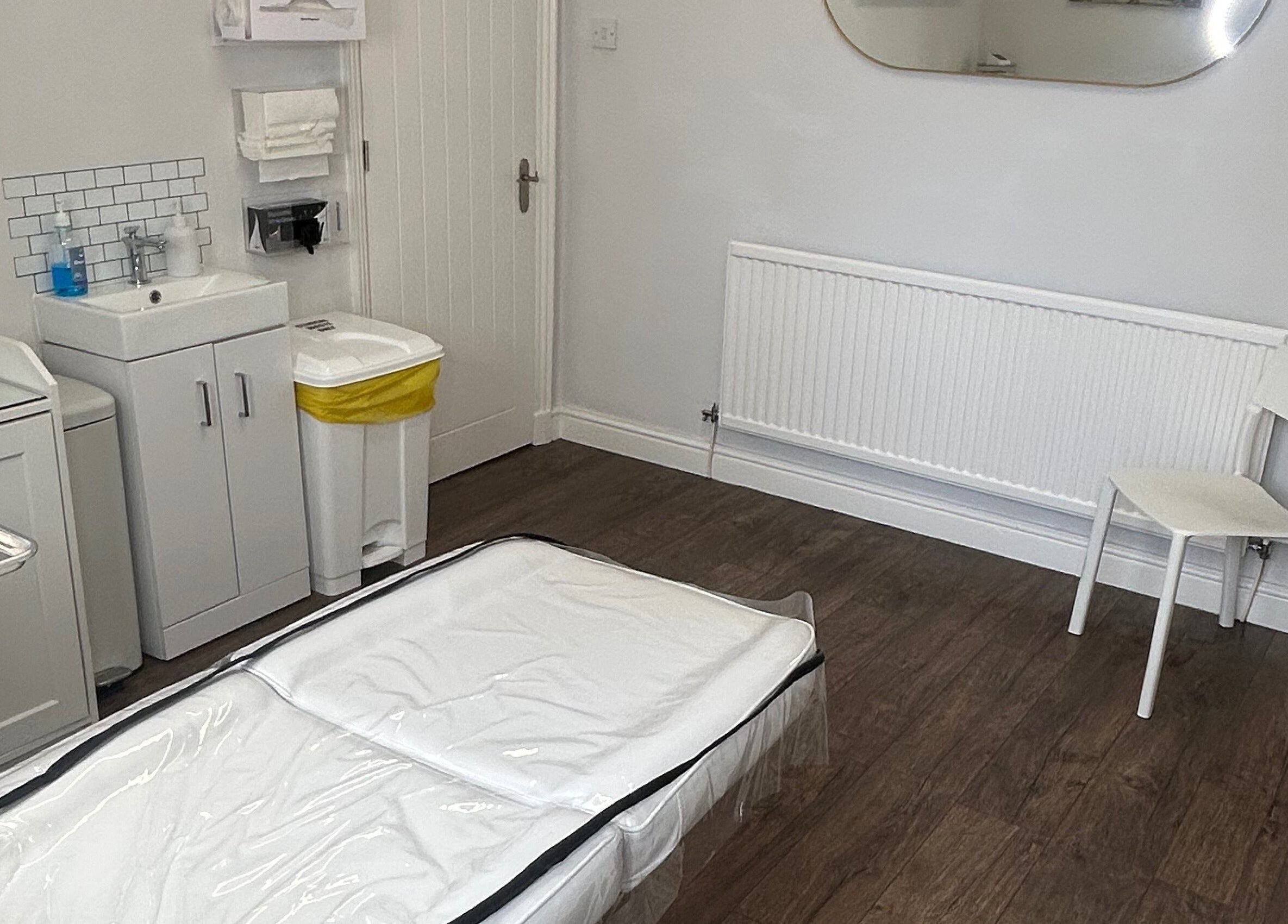 Clean treatment room at Impeccable Aesthetics, Warrington, England, GB featuring a serene setting.