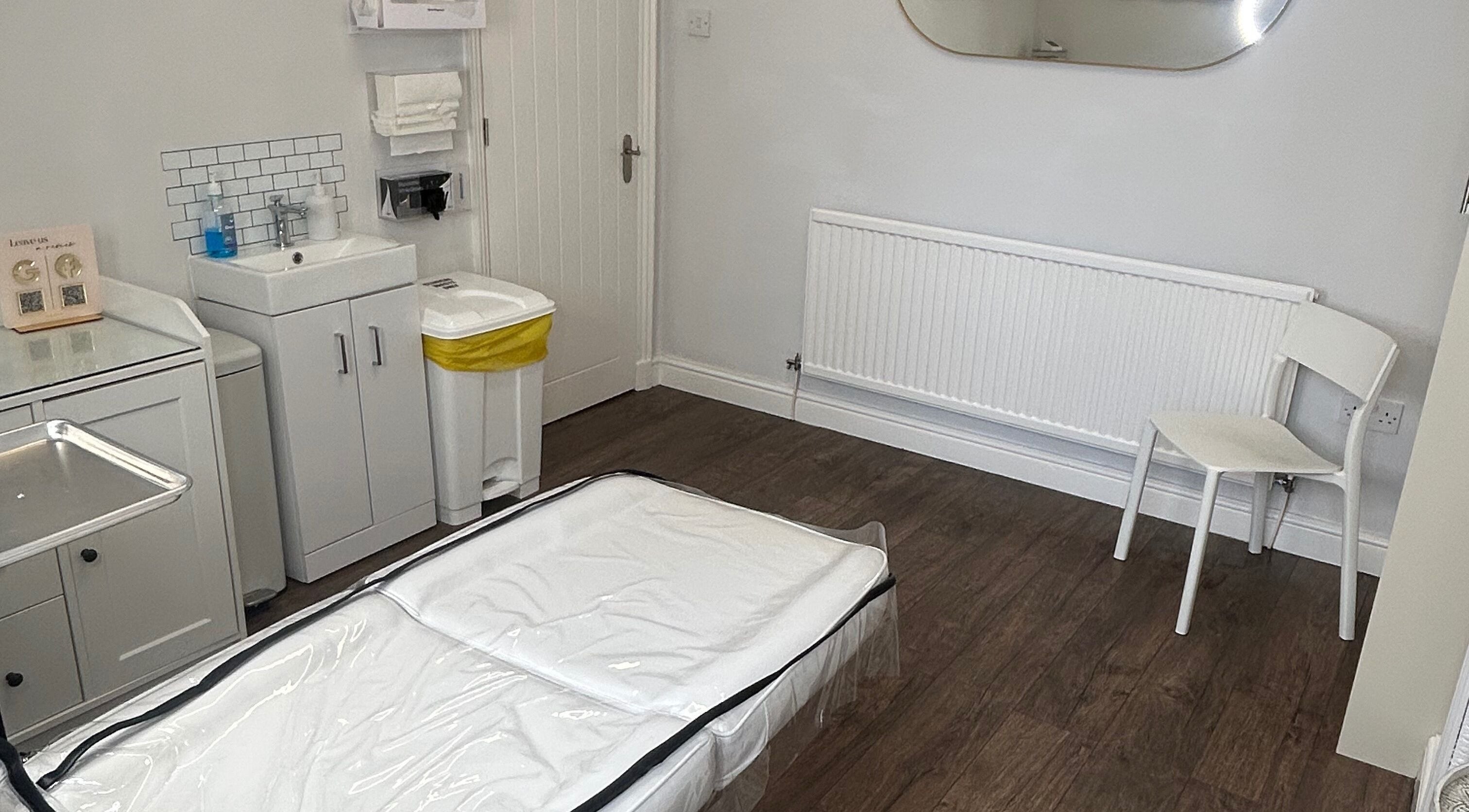 Clean treatment room at Impeccable Aesthetics, Warrington, England, GB featuring a serene setting.
