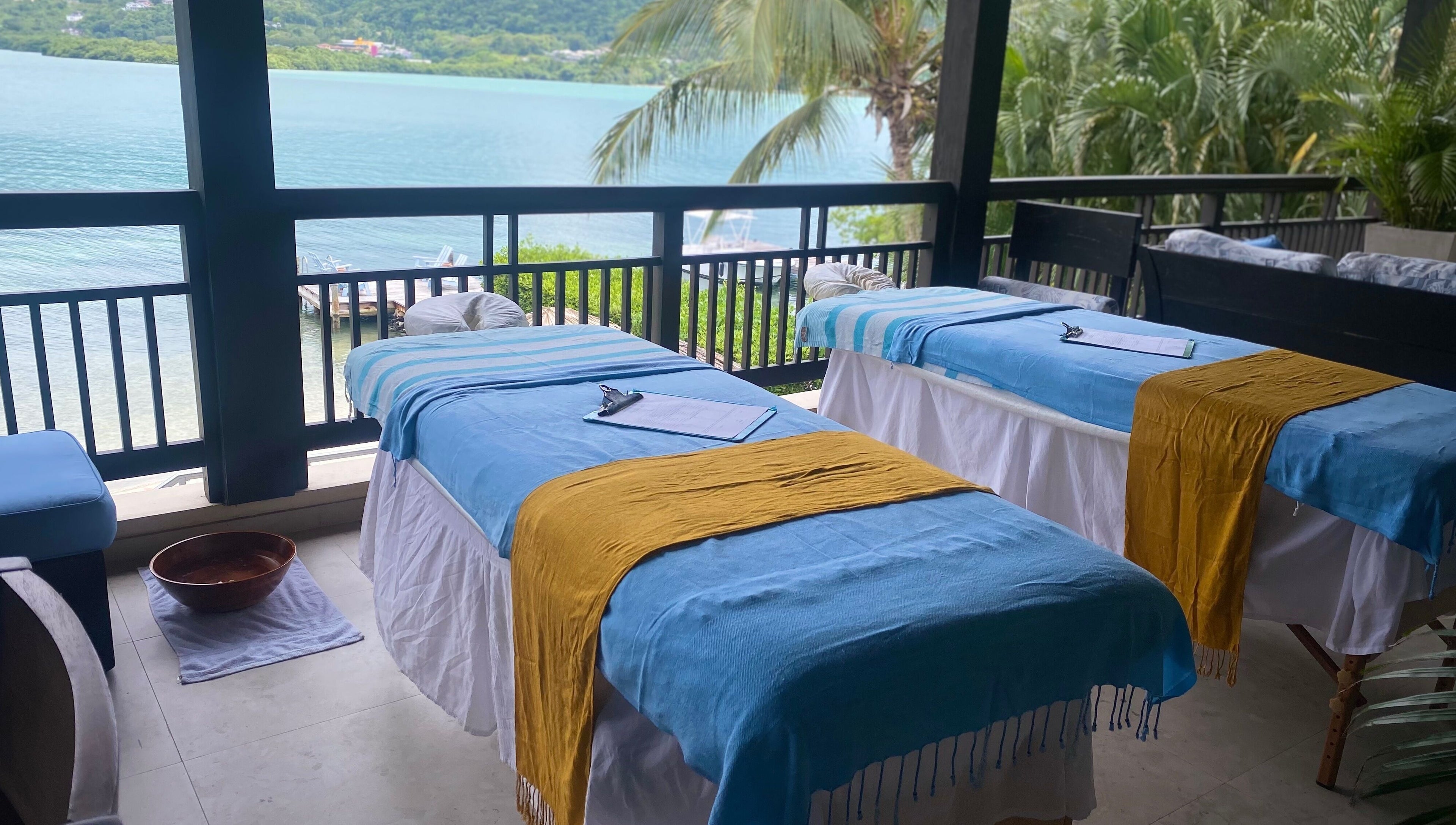 Outdoor massage beds at Ocean Serenity Relaxing Massages, Across, Jamaica, JM, with a stunning ocean view.