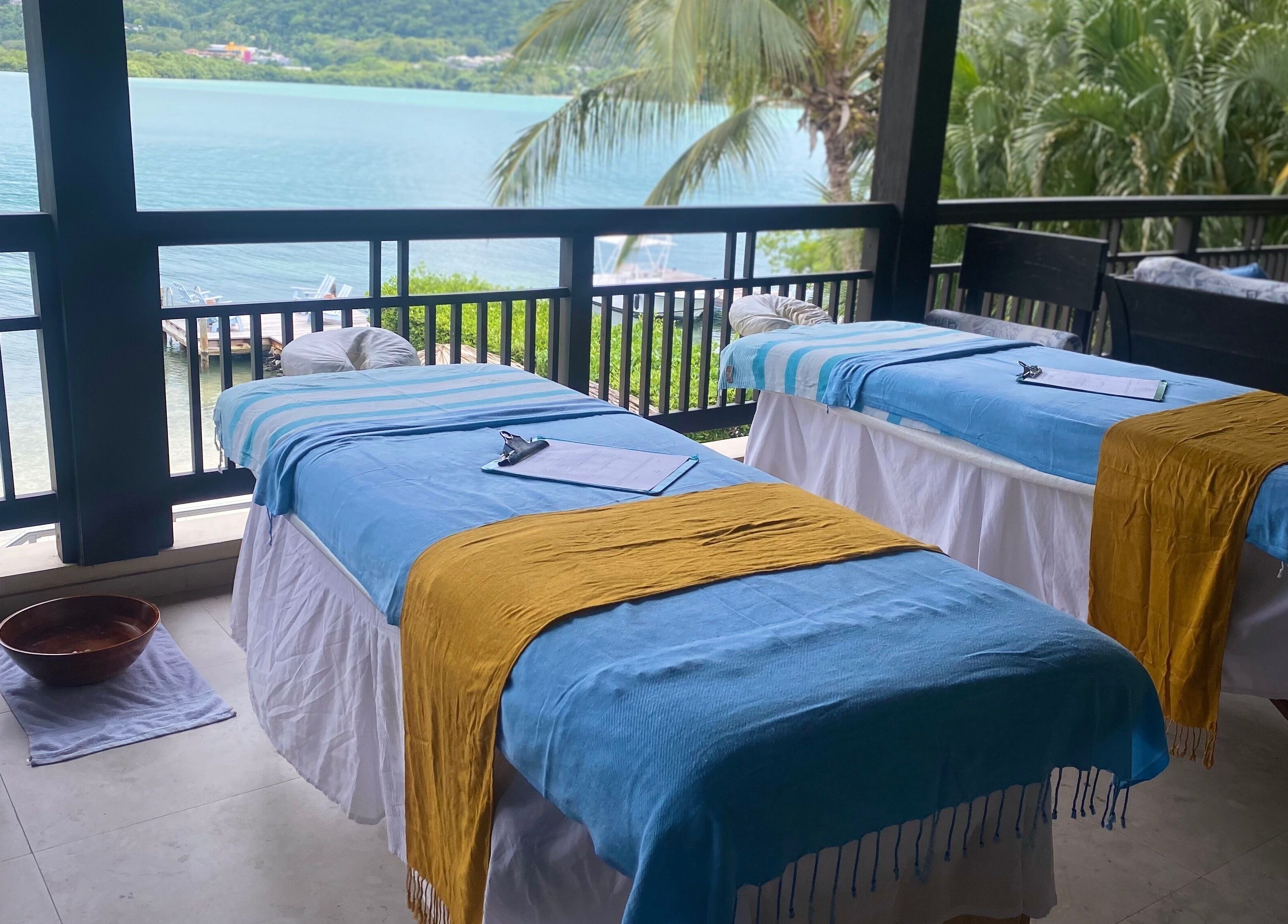 Outdoor massage beds at Ocean Serenity Relaxing Massages, Across, Jamaica, JM, with a stunning ocean view.