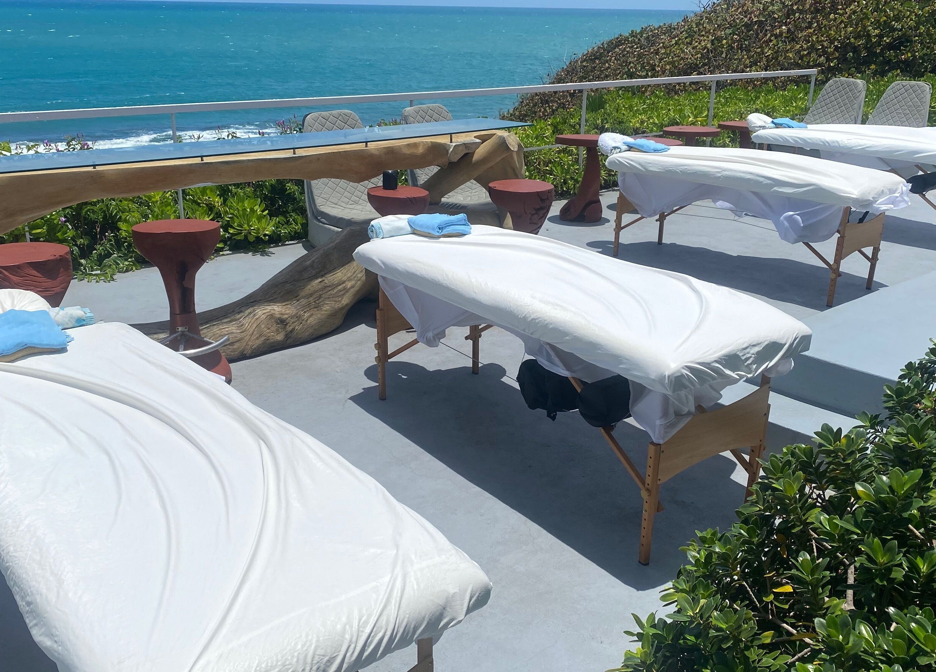 Outdoor massage tables by the ocean at Ocean Serenity Relaxing Massages, Across, Jamaica, JM.