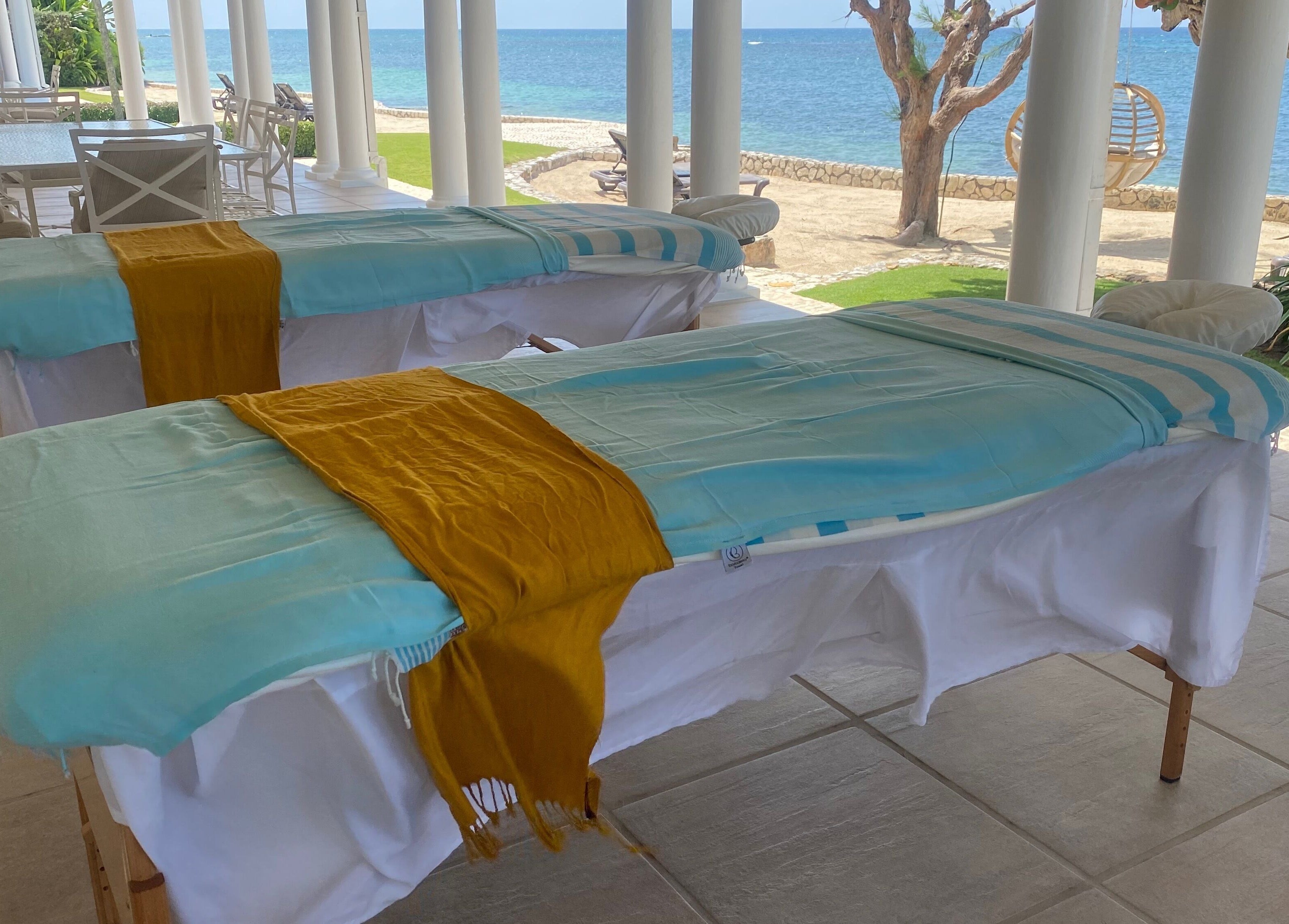 Massage tables at Ocean Serenity Relaxing Massages, Across, Jamaica, JM, with ocean view.