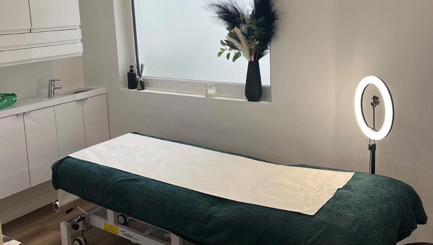 Therapeutic massage room at Black Ivy, Swanley, England, GB with a cozy bed and ambient lighting.