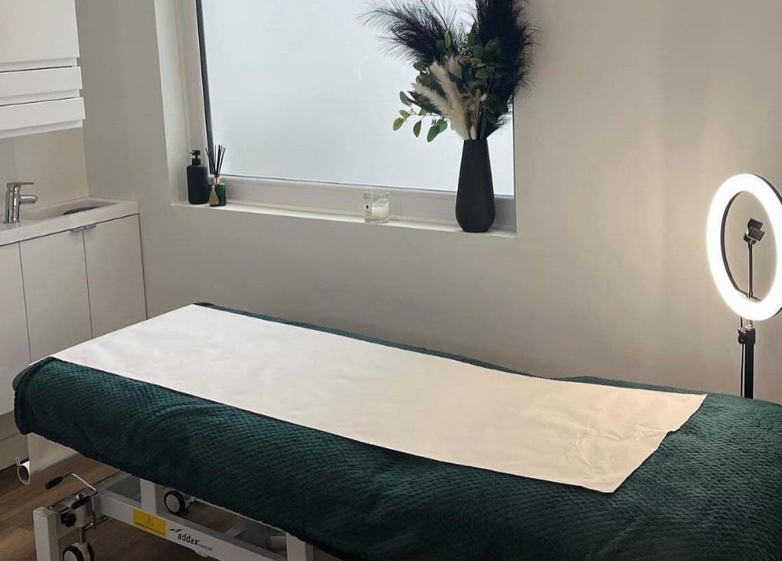Therapeutic massage room at Black Ivy, Swanley, England, GB with a cozy bed and ambient lighting.
