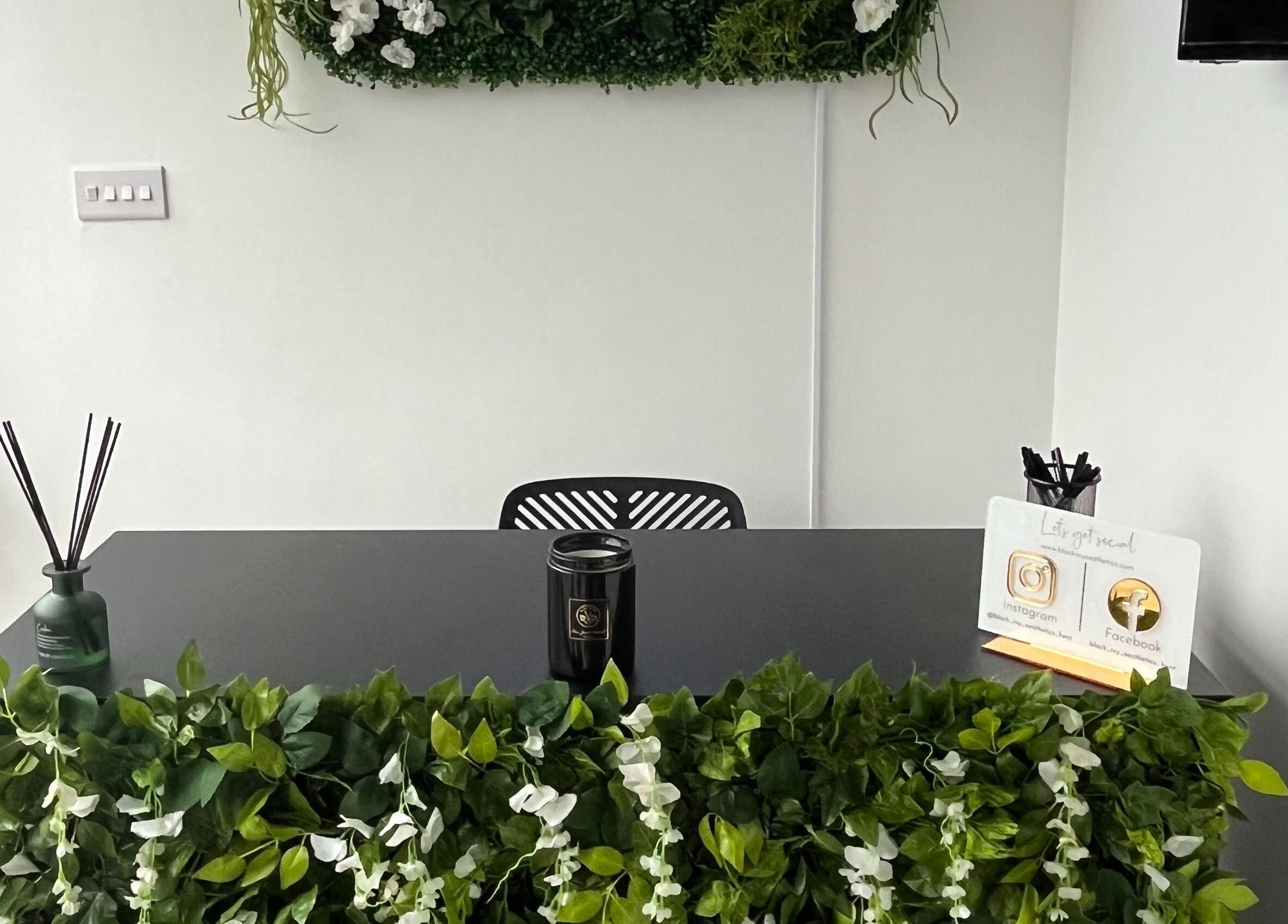 Sophisticated reception at Black Ivy, Swanley, England, GB with greenery and chic decor.