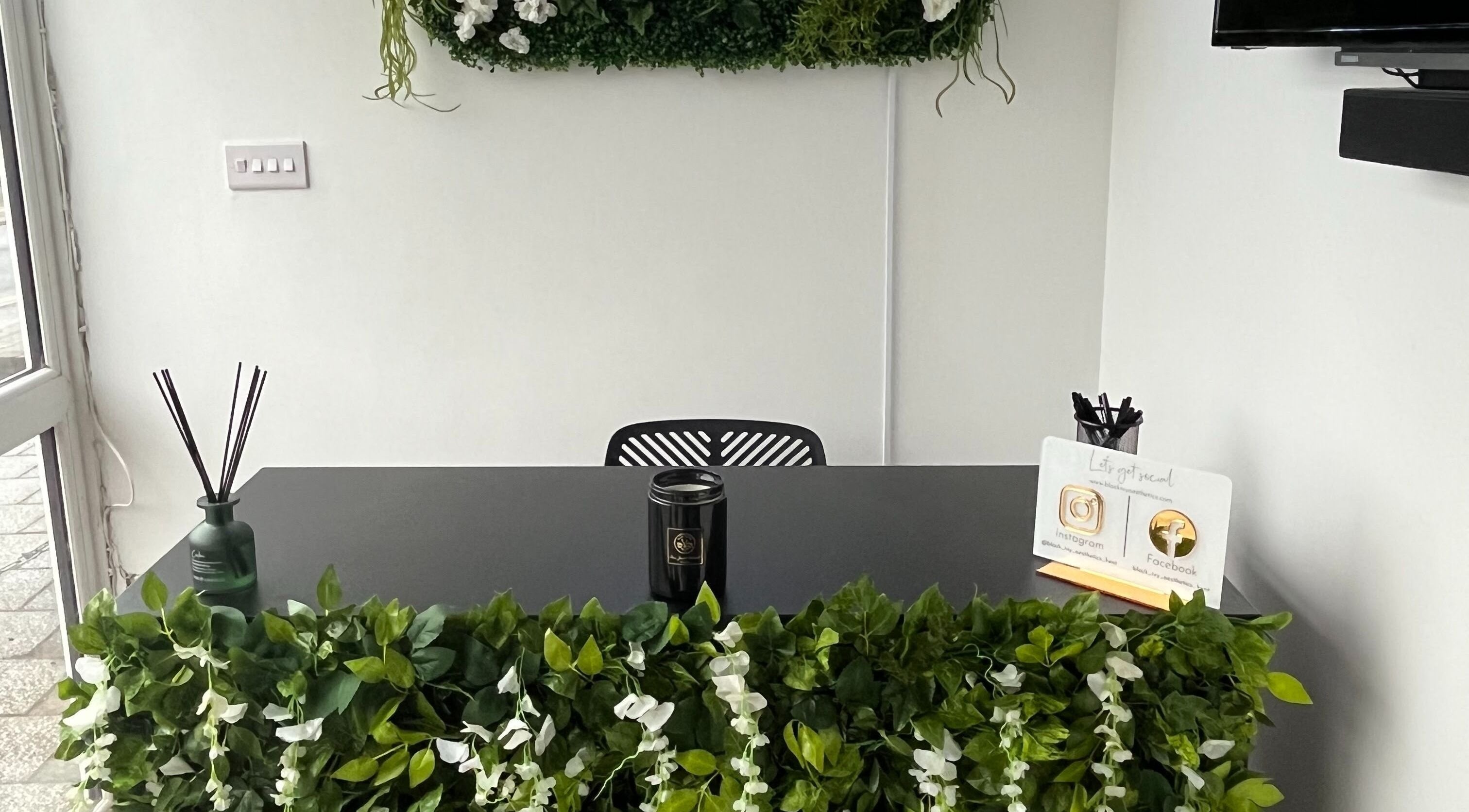 Sophisticated reception at Black Ivy, Swanley, England, GB with greenery and chic decor.