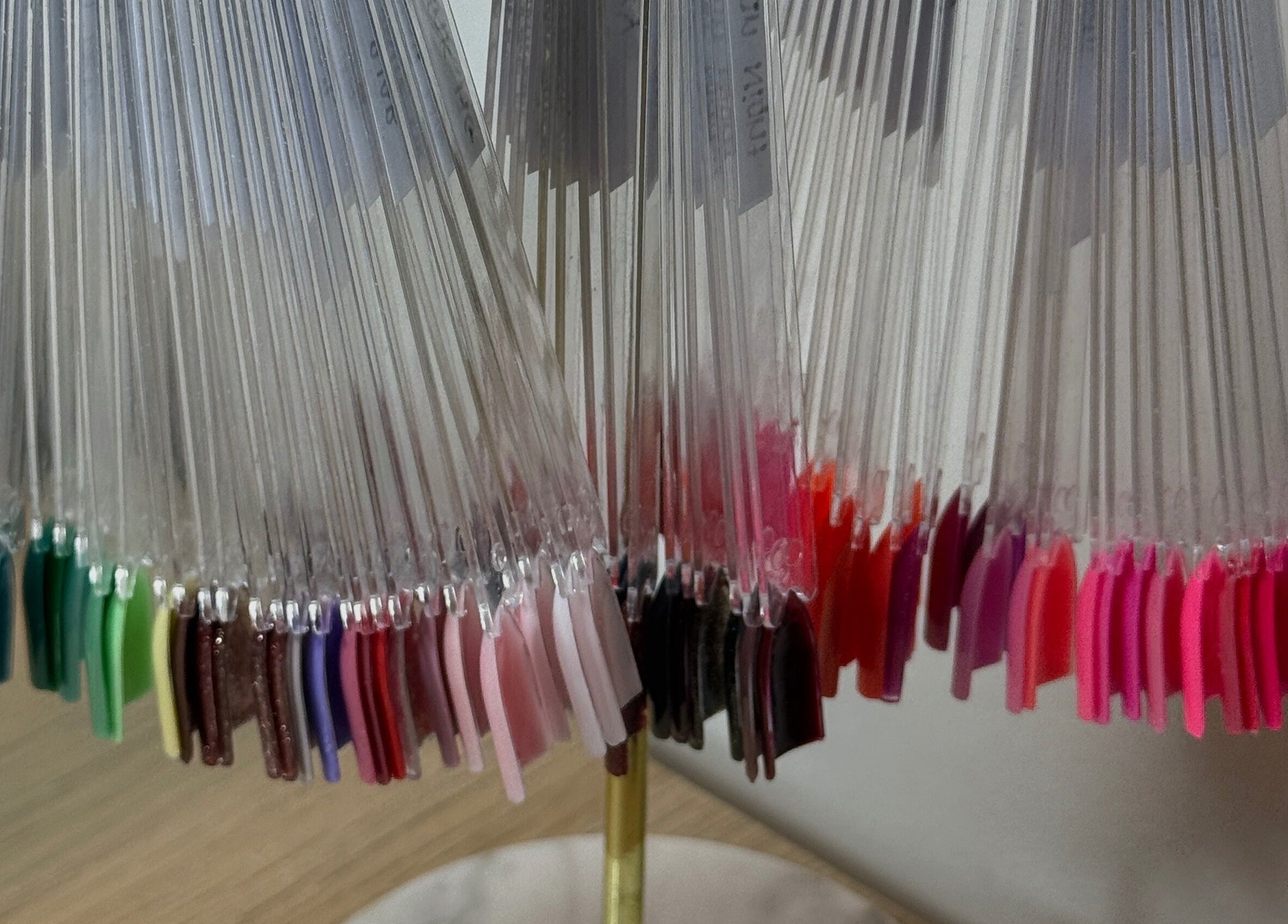 Colorful nail polish samples on display at STELLO Beauty Bar in West Dunbartonshire, Scotland, GB.