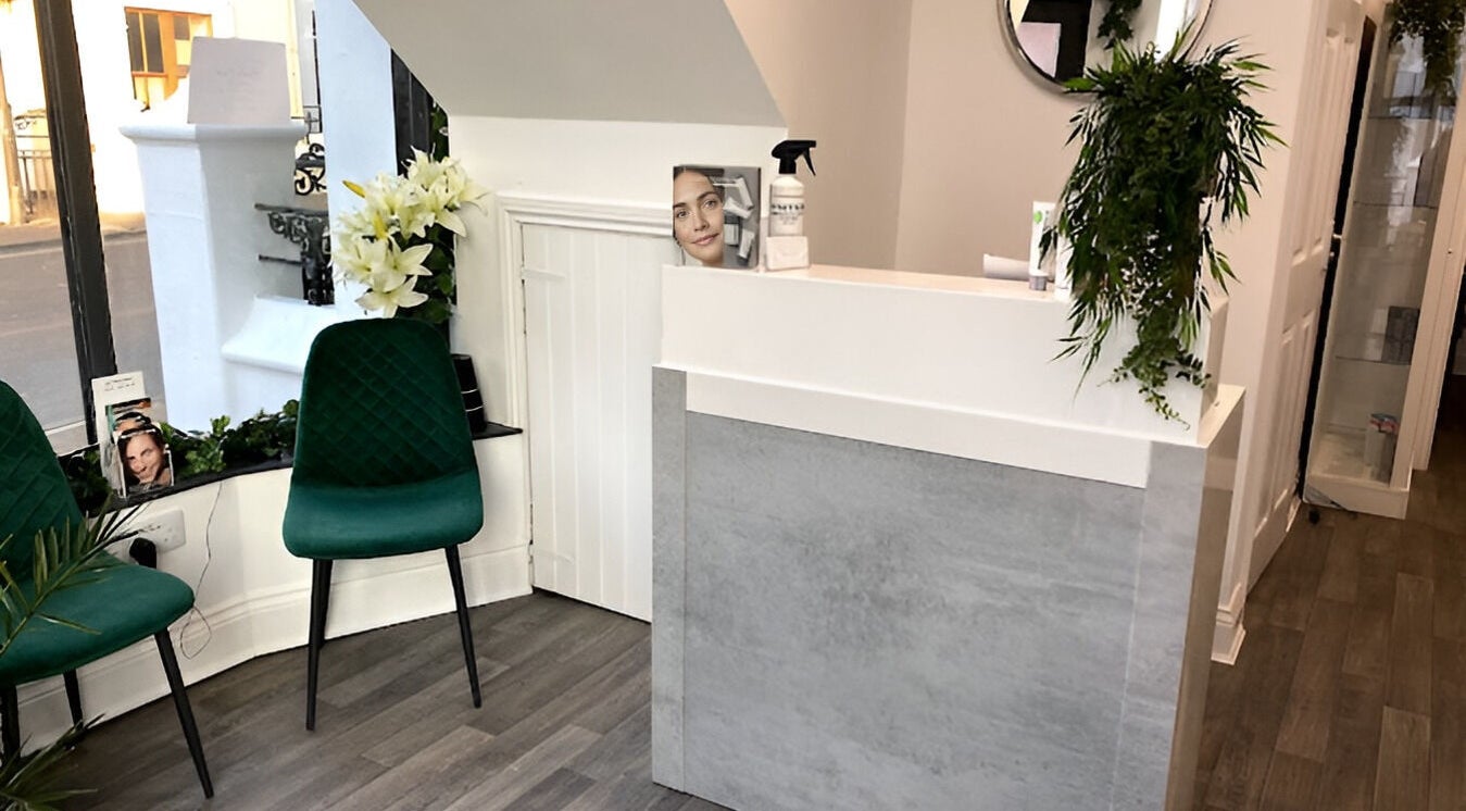 Reception area at The Lily Retreat Skin & Beauty Rooms, Peel, GB featuring elegant decor and seating.