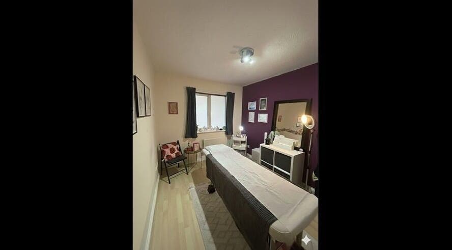Cozy treatment room at Wax Wurks, Paignton, England, GB with massage bed and calming decor.