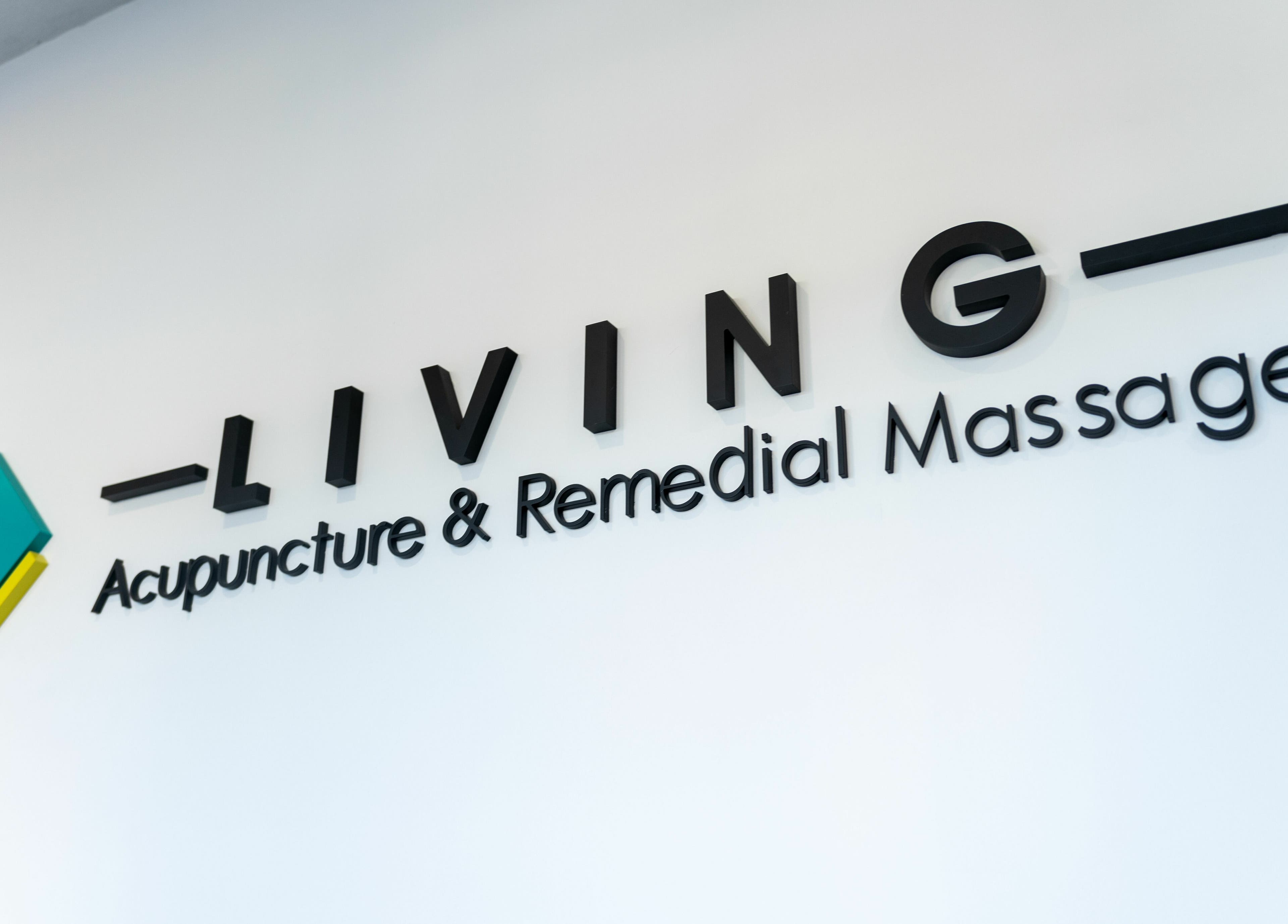 Living Acupuncture & Remedial Massage Subiaco logo on a white wall in Subiaco, Western Australia, AU.