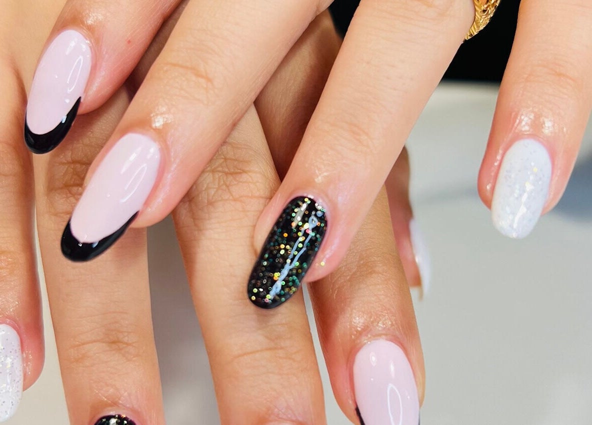 Chic nail designs showcased at Luxury Spa, Al Qatif, Eastern Province, SA, featuring black and white accents.