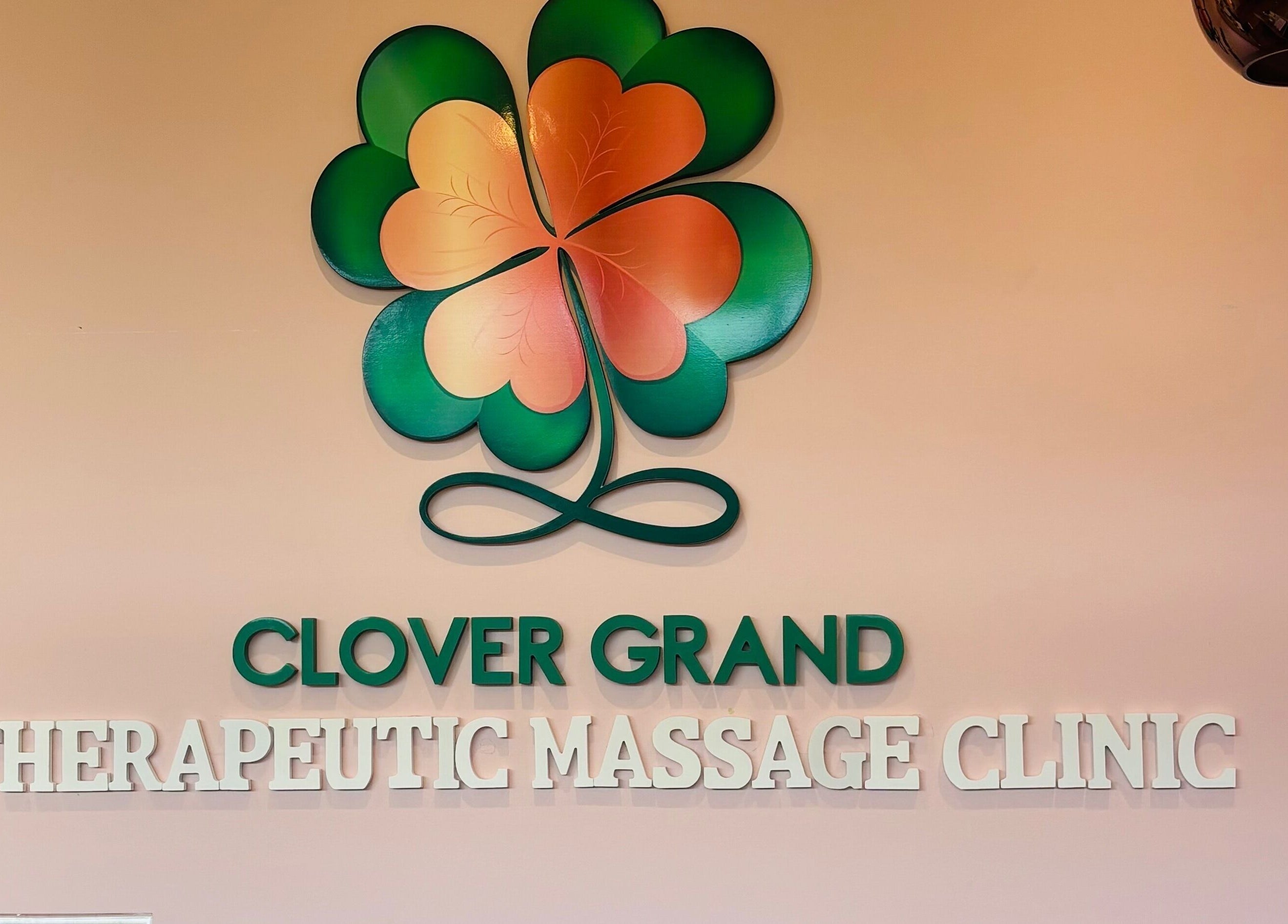 Clover Grand Therapeutic Massage Clinic logo on the wall, Forestville, New South Wales, AU.