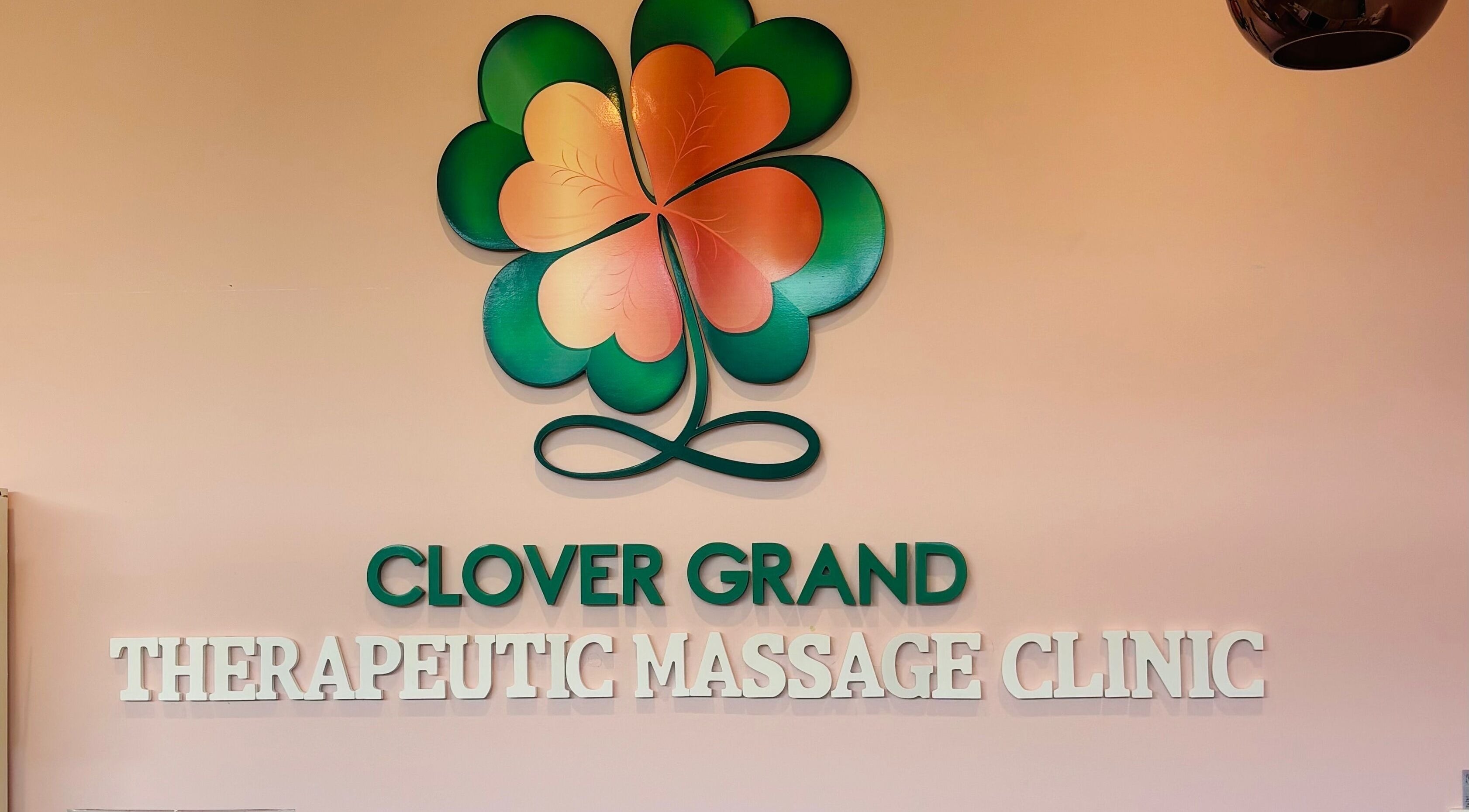 Clover Grand Therapeutic Massage Clinic logo on the wall, Forestville, New South Wales, AU.
