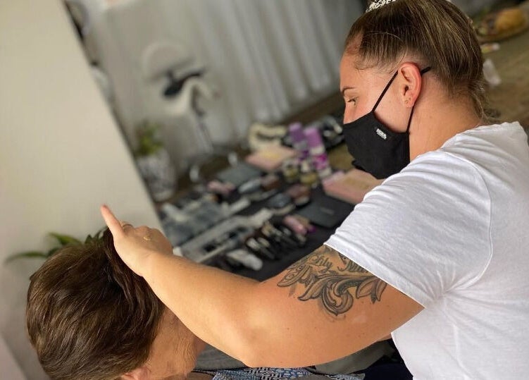 Hair stylist at Uneek Hair Tanilba Bay, New South Wales, AU providing premium hair care.