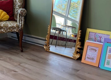 Cozy room with ornate mirror and art at Good Karma Studios, Lower Sackville, Nova Scotia, CA.