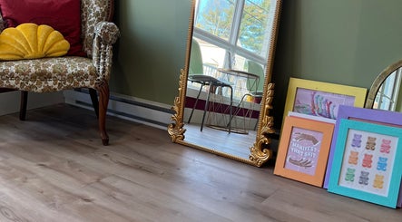 Cozy room with ornate mirror and art at Good Karma Studios, Lower Sackville, Nova Scotia, CA.