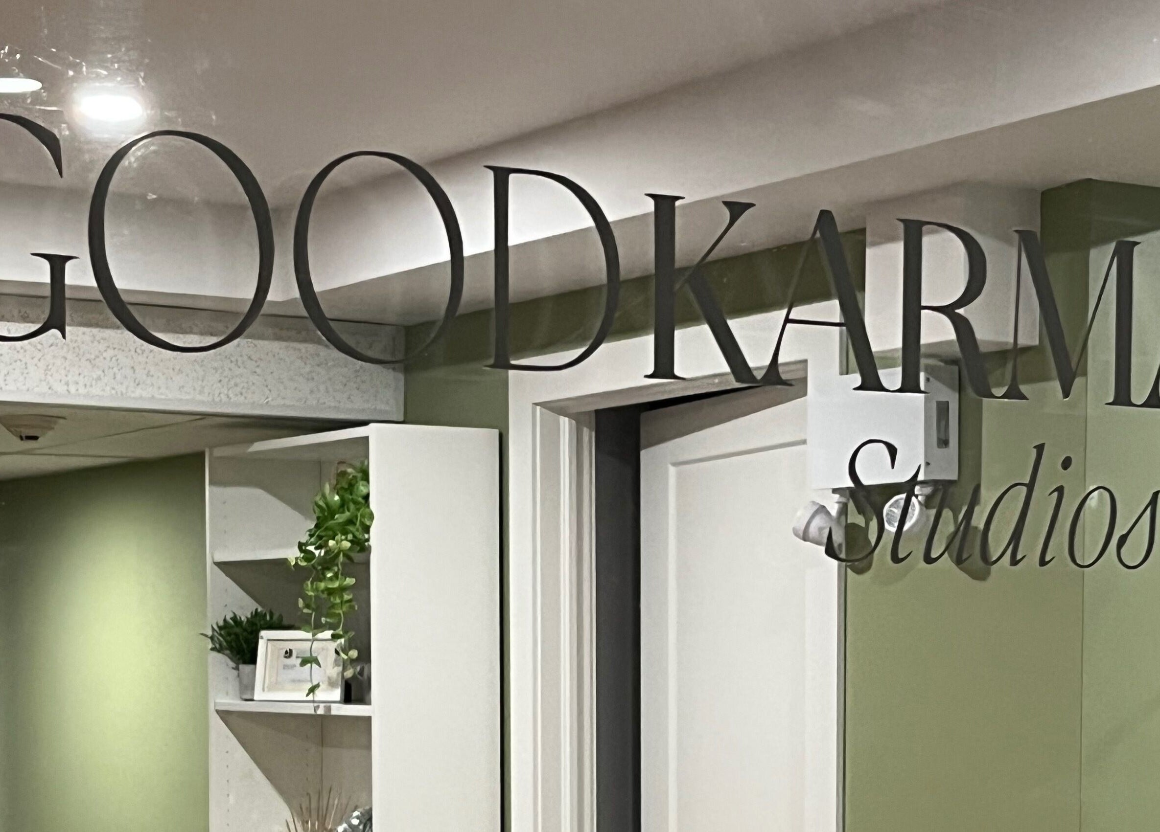 Entrance sign of Good Karma Studios in Lower Sackville, Nova Scotia, CA, welcoming visitors warmly.