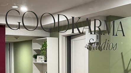 Entrance sign of Good Karma Studios in Lower Sackville, Nova Scotia, CA, welcoming visitors warmly.