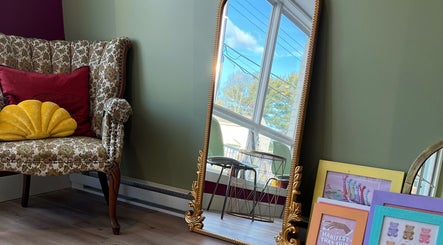 Elegant vintage chair and ornate mirror at Good Karma Studios, Lower Sackville, Nova Scotia, CA.