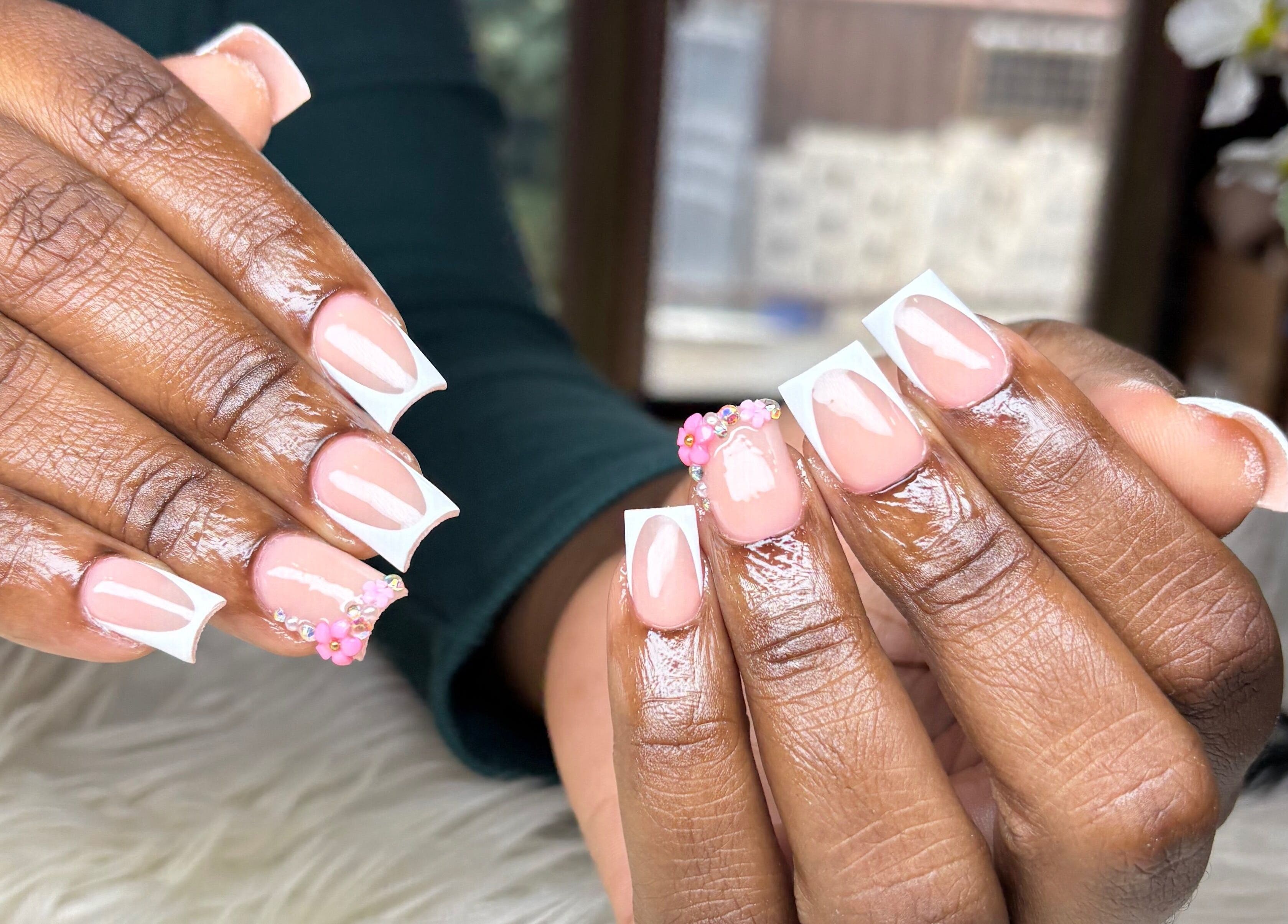 Stylish pink and white nails with floral art at Vxsnail Studio, Spanish Town, St. Catherine Parish, JM.