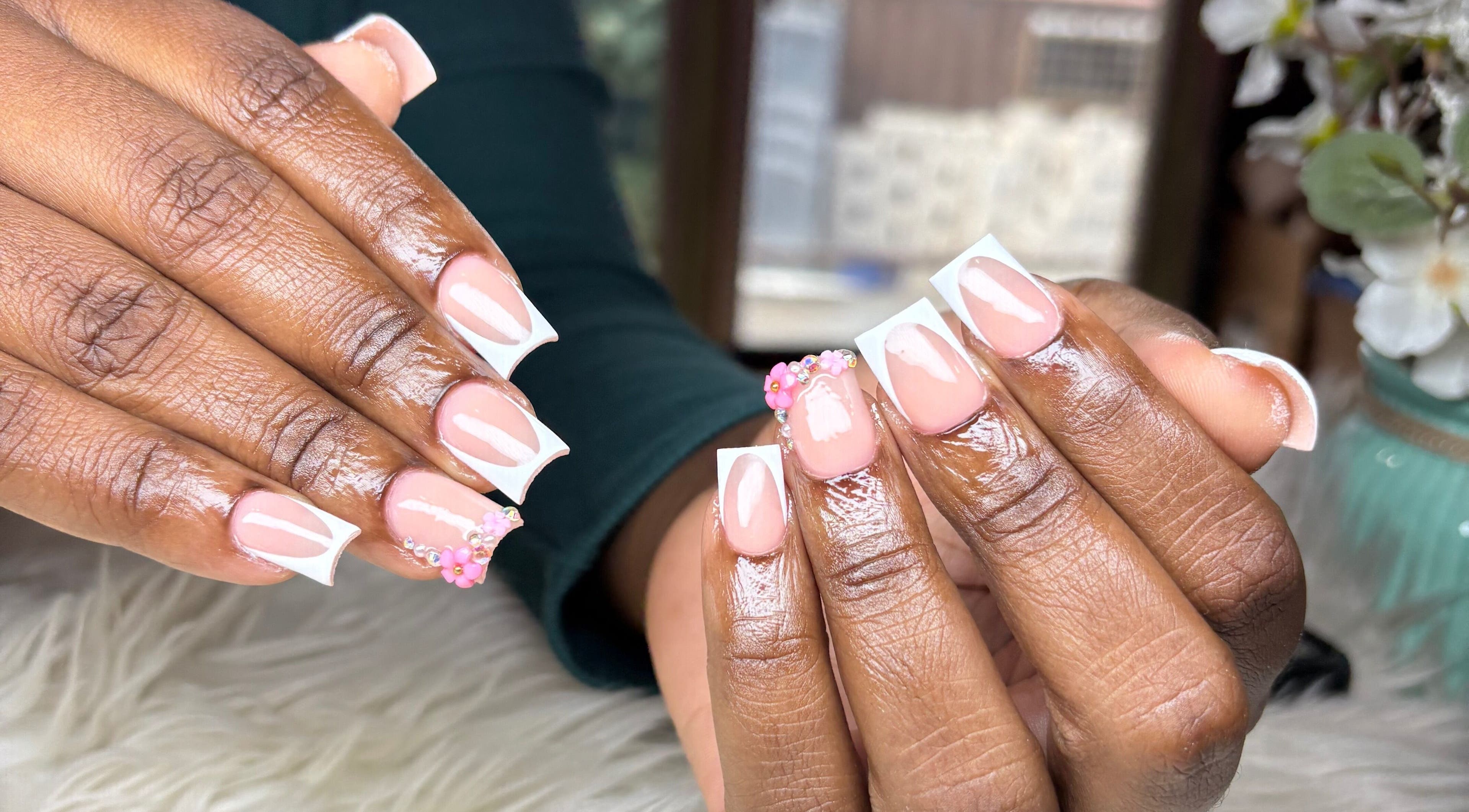 Stylish pink and white nails with floral art at Vxsnail Studio, Spanish Town, St. Catherine Parish, JM.