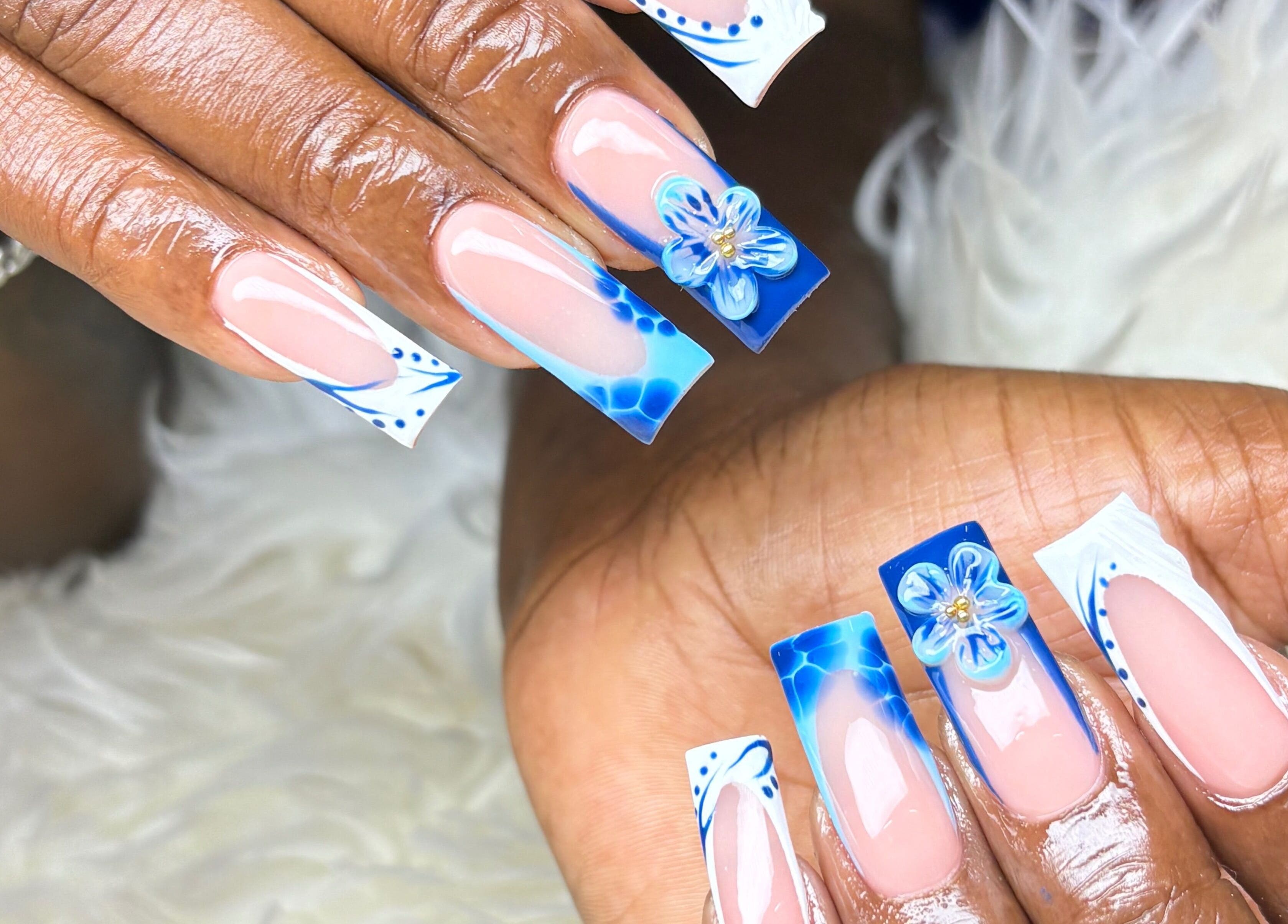 Intricate blue floral nail art at Vxsnail Studio, Spanish Town, St. Catherine Parish, JM.