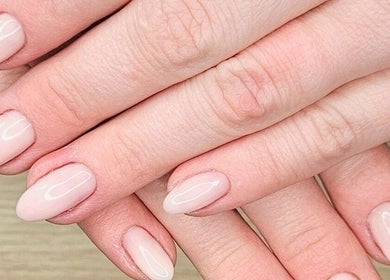 Stylish pink manicure at Whisk Beauty, Blenheim, Marlborough, NZ. Perfectly polished nails on display.