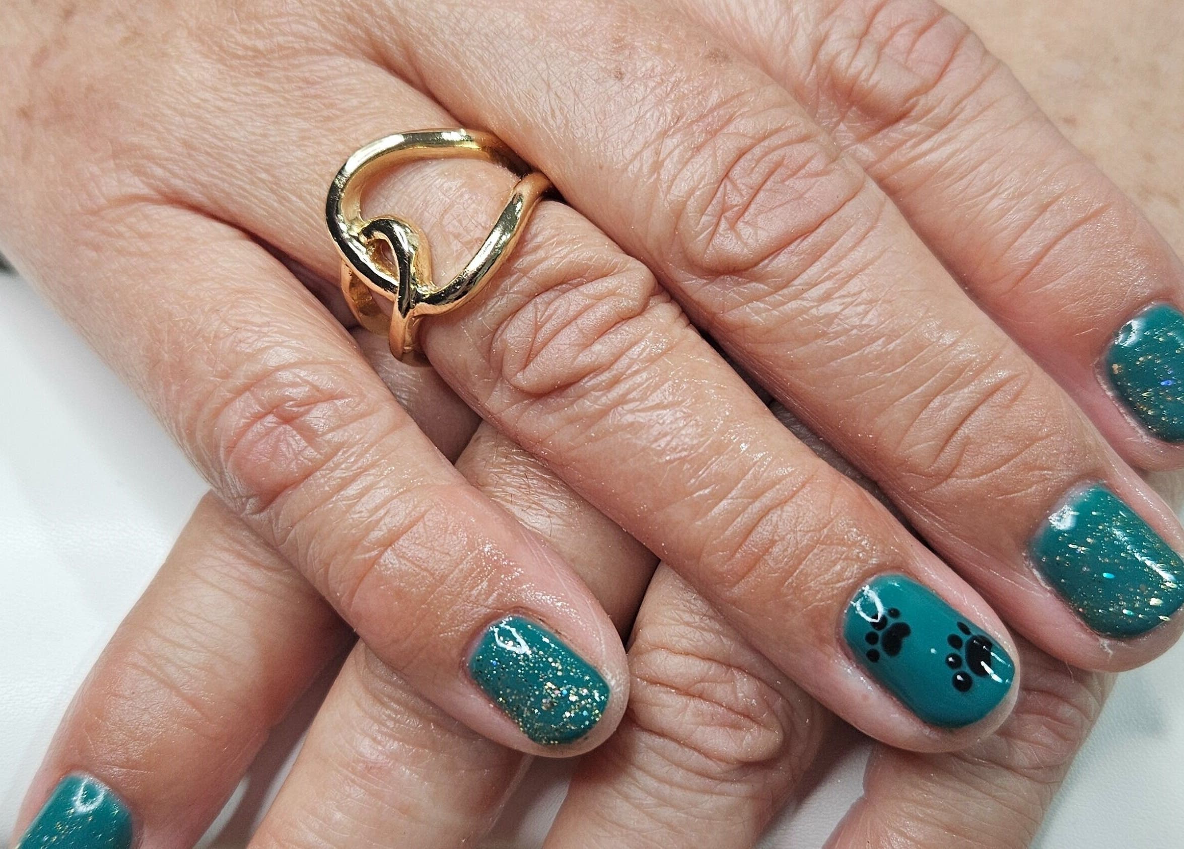 Stylish emerald nail art at Whisk Beauty, Blenheim, Marlborough, NZ, showcasing intricate designs.