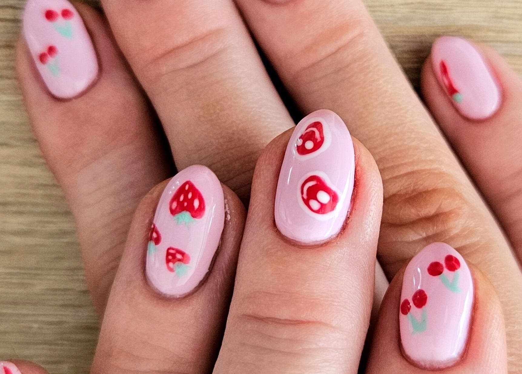 Close-up of berry-themed nail art at Whisk Beauty, Blenheim, Marlborough, NZ.