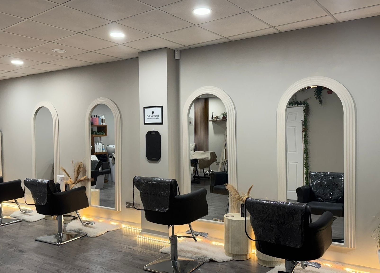 Elegant salon chairs and mirrors at House Of Serenity, Ferring, England, GB, offering a tranquil beauty experience.