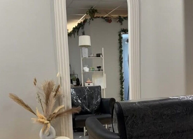 Elegant salon interior at House Of Serenity, Ferring, England, GB showcasing chic decor and cozy seating.