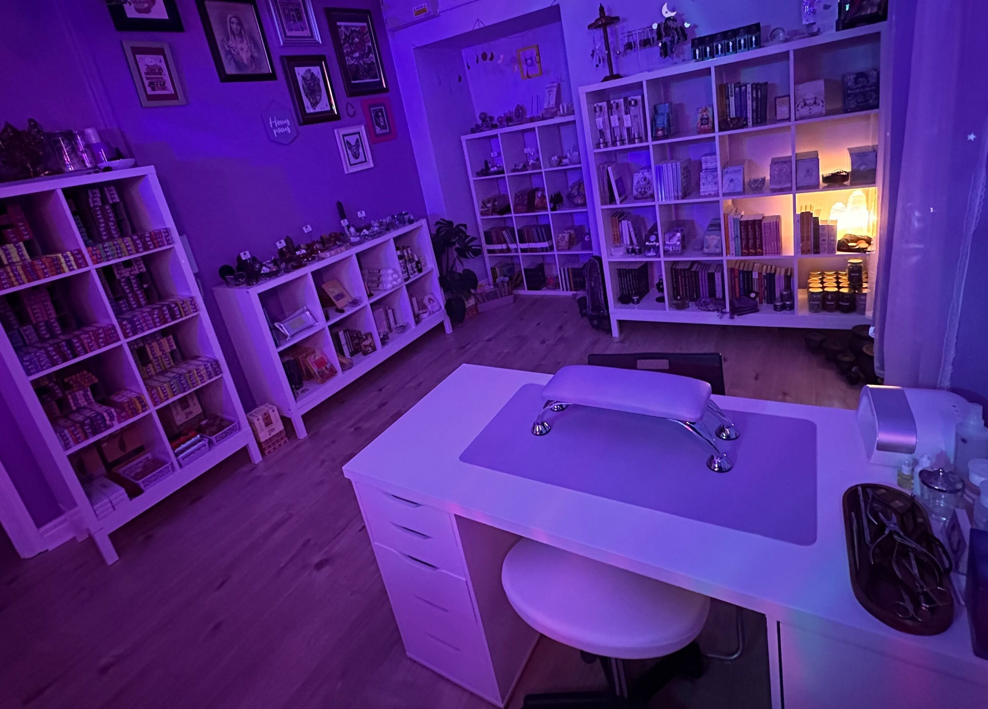 Cozy nail salon interior at Sigil + Skin in Sunderland, United Kingdom, GB with purple ambient lighting.