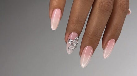 Elegant ombre nails with 3D butterfly art at Koko the Nail Artist, Amman, Amman Governorate, JO.